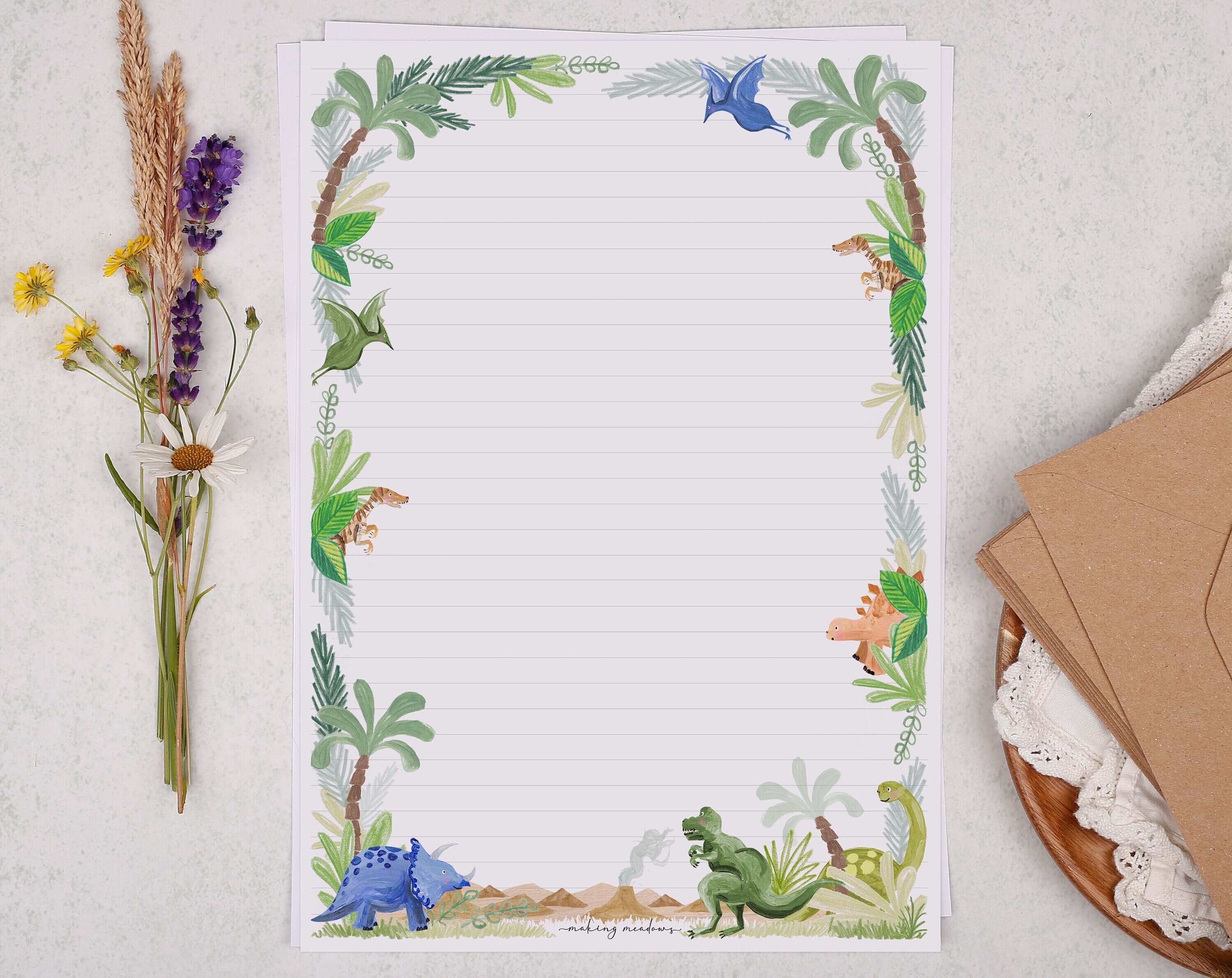 A4 writing paper with dinosaur jungle. Stationery designed by Making Meadows