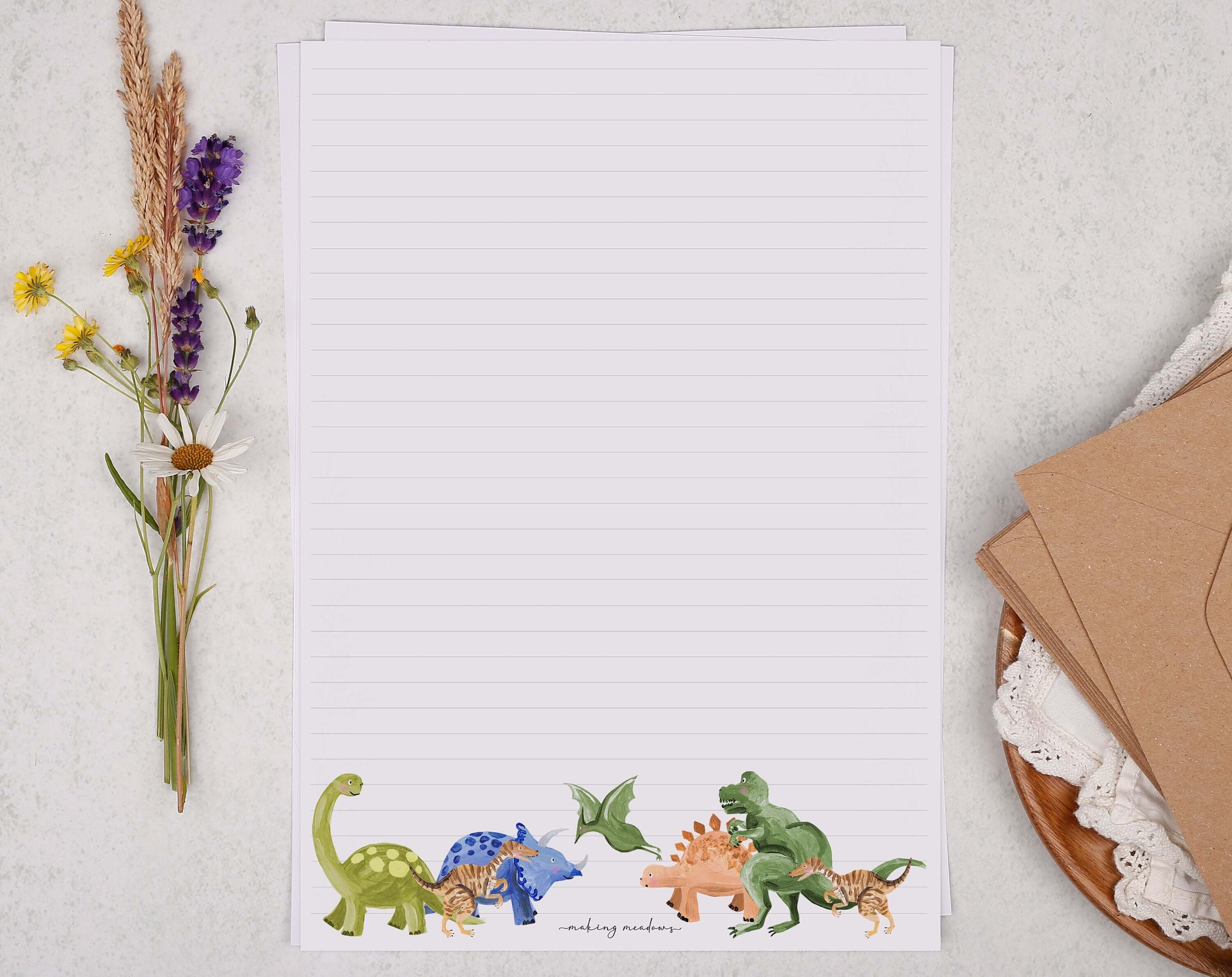 A4 writing paper with dinosaurs. Stationery designed by Making Meadows