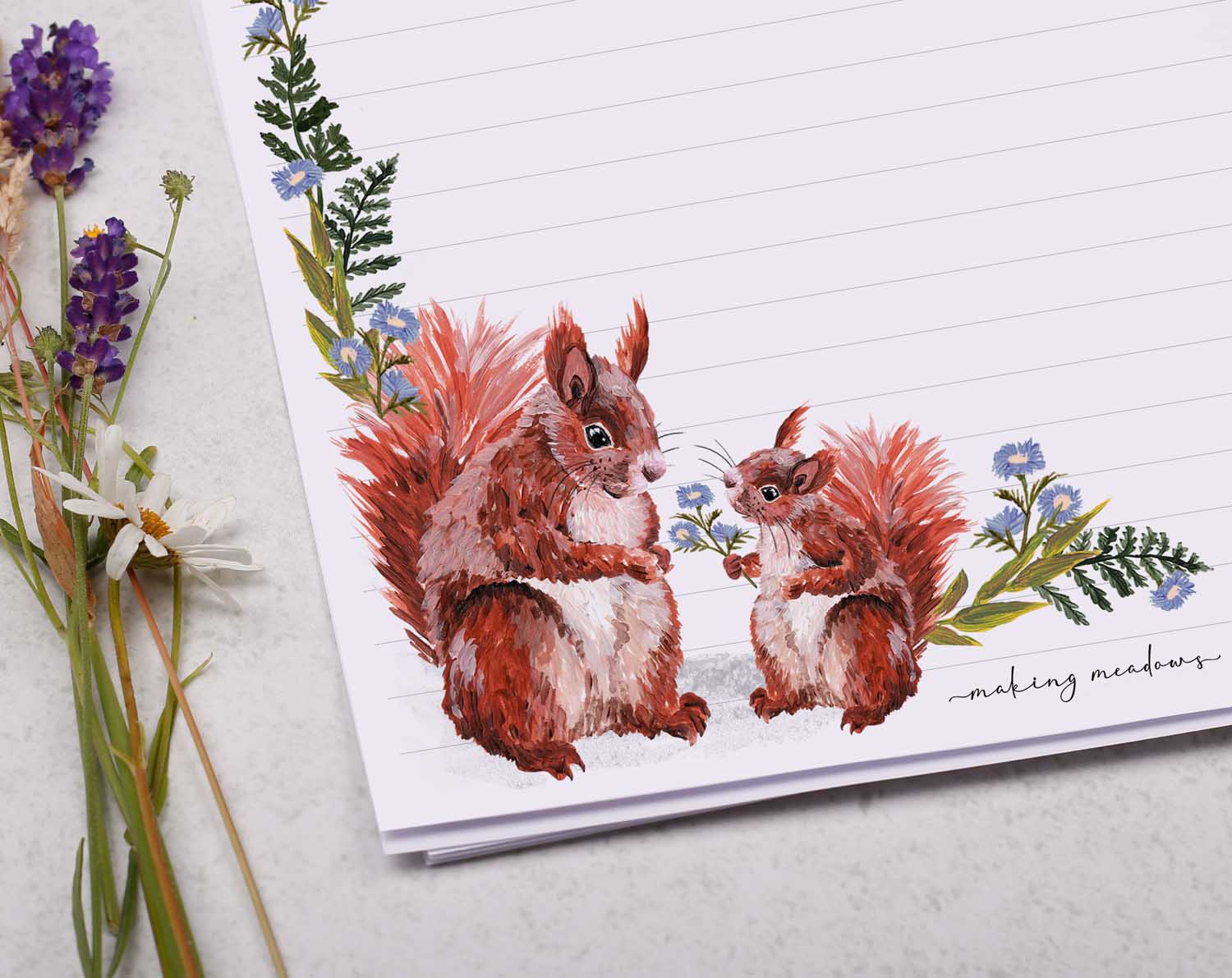 A4 writing paper with red squirrels and blue floral border. Stationery designed by Making Meadows