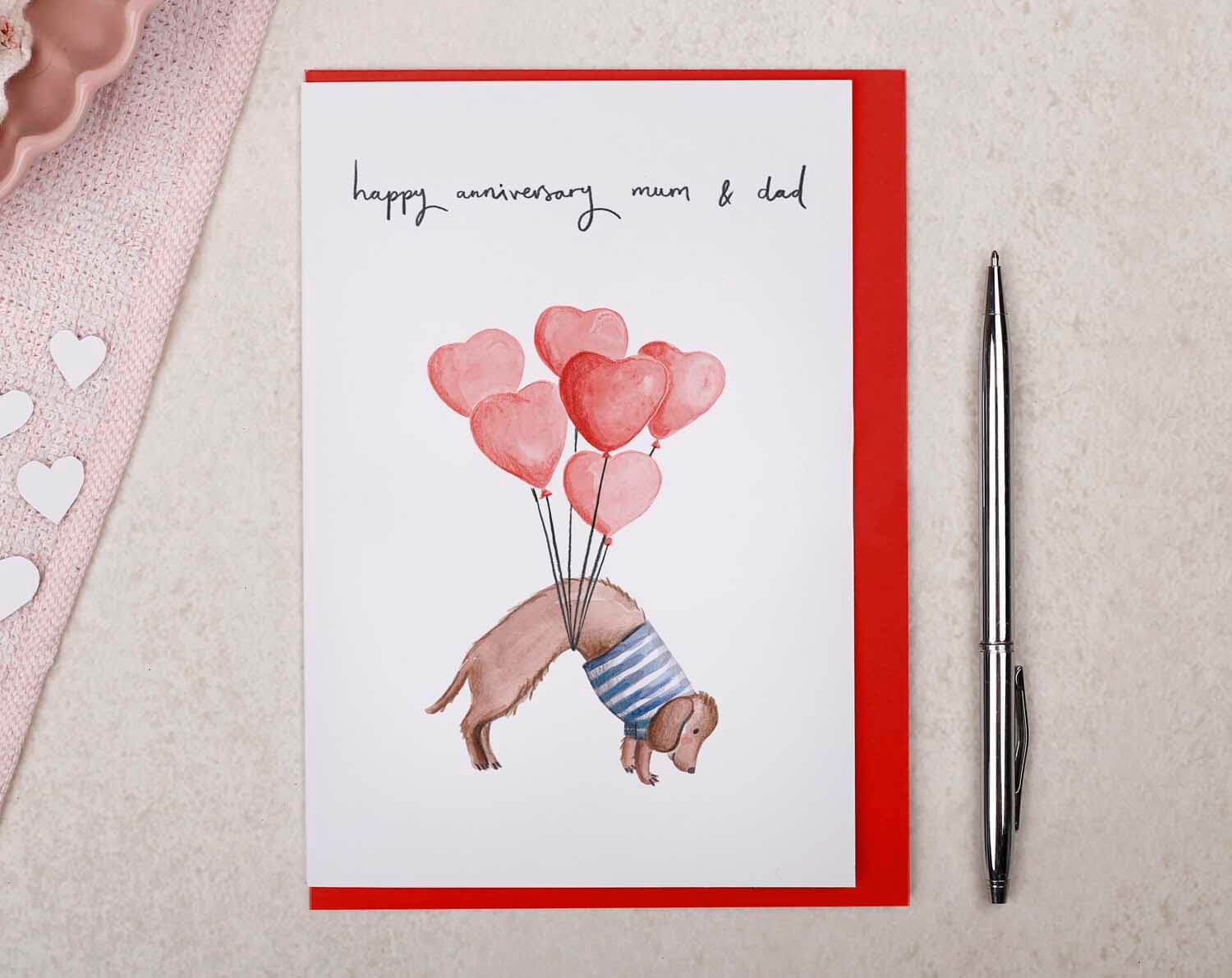Sausage Dog Mum & Dad Anniversary Card. Greeting Cards designed by Making Meadows