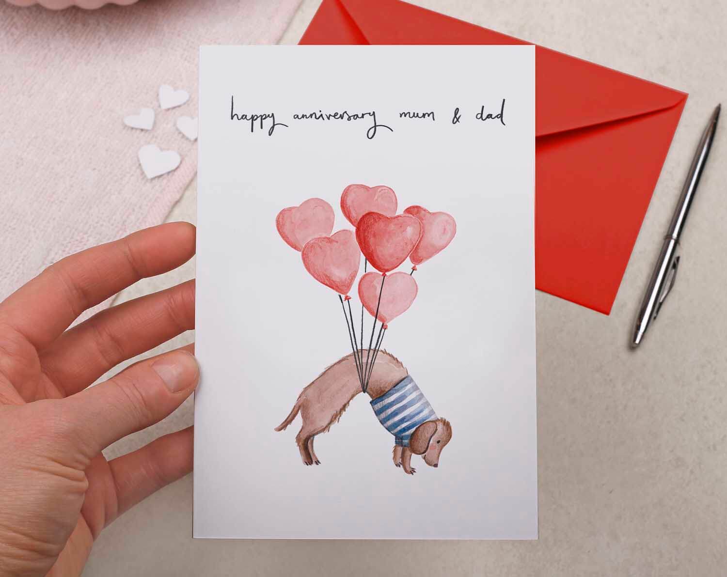 Sausage Dog Mum & Dad Anniversary Card. Greeting Cards designed by Making Meadows