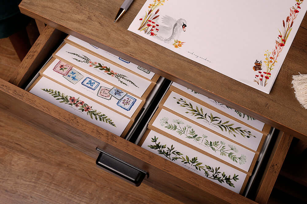 Writing Space at Home featuring a wooden desk drawer filled with decorative papers and stationery.