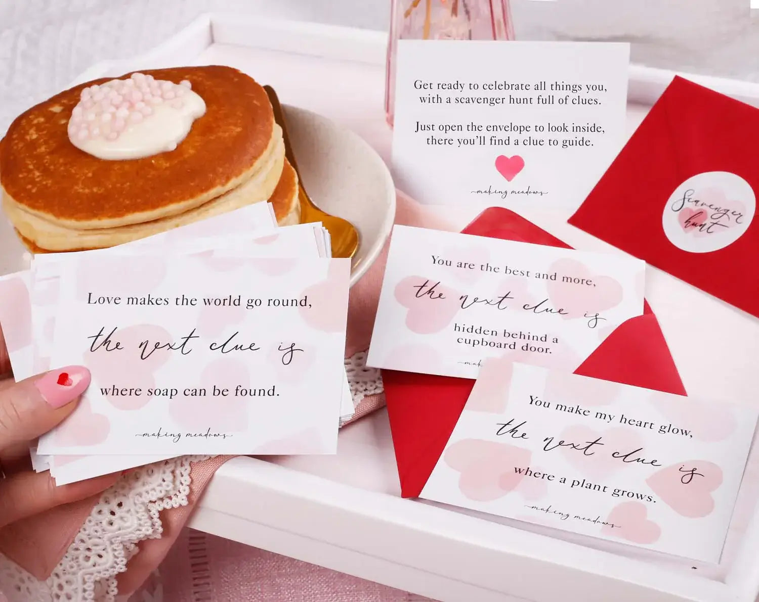 Organising a Scavenger Hunt cards and clues with breakfast on a tray, perfect for a special surprise.