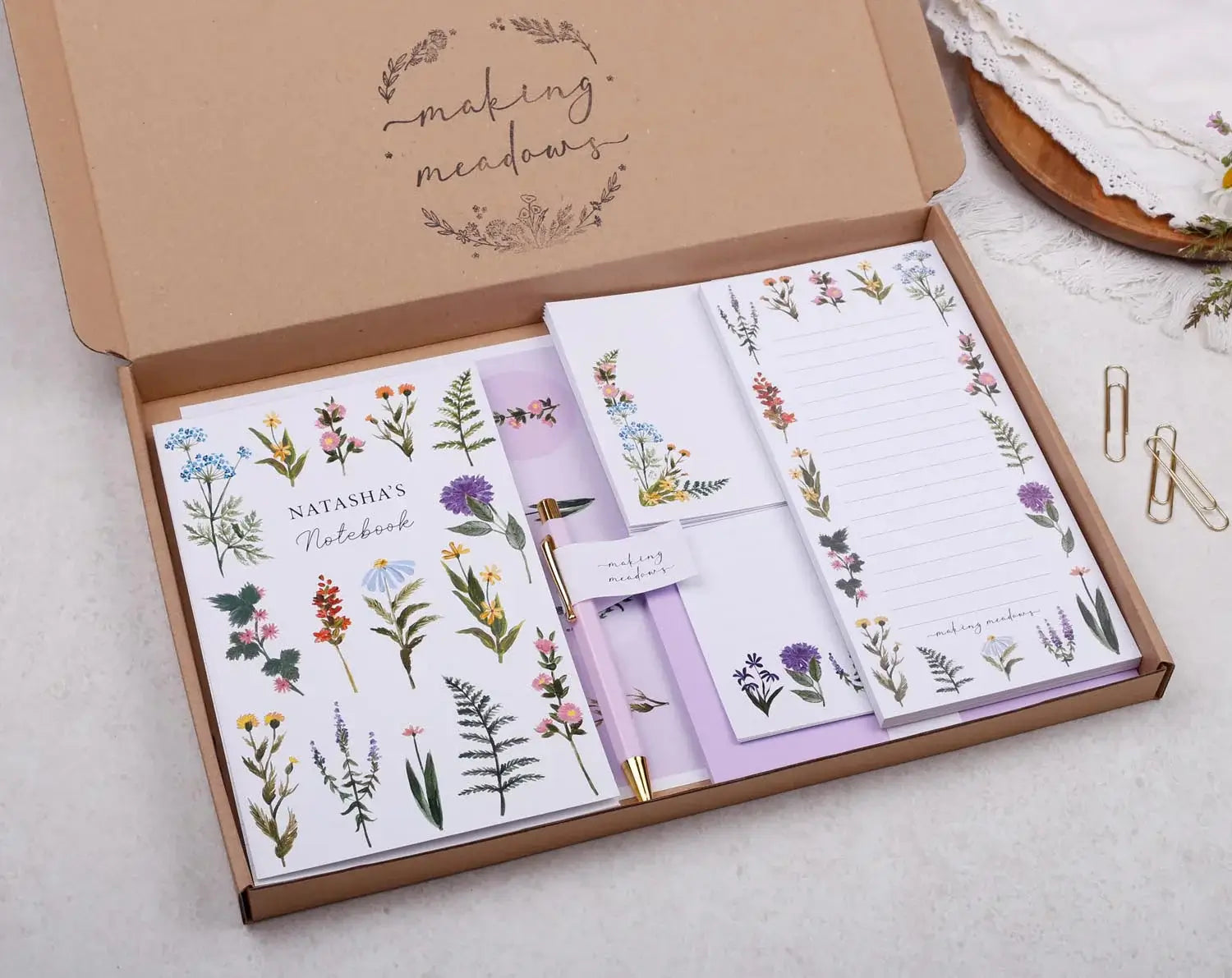 Beautiful stationery gift boxes featuring floral designs and notebooks for stationery lovers.