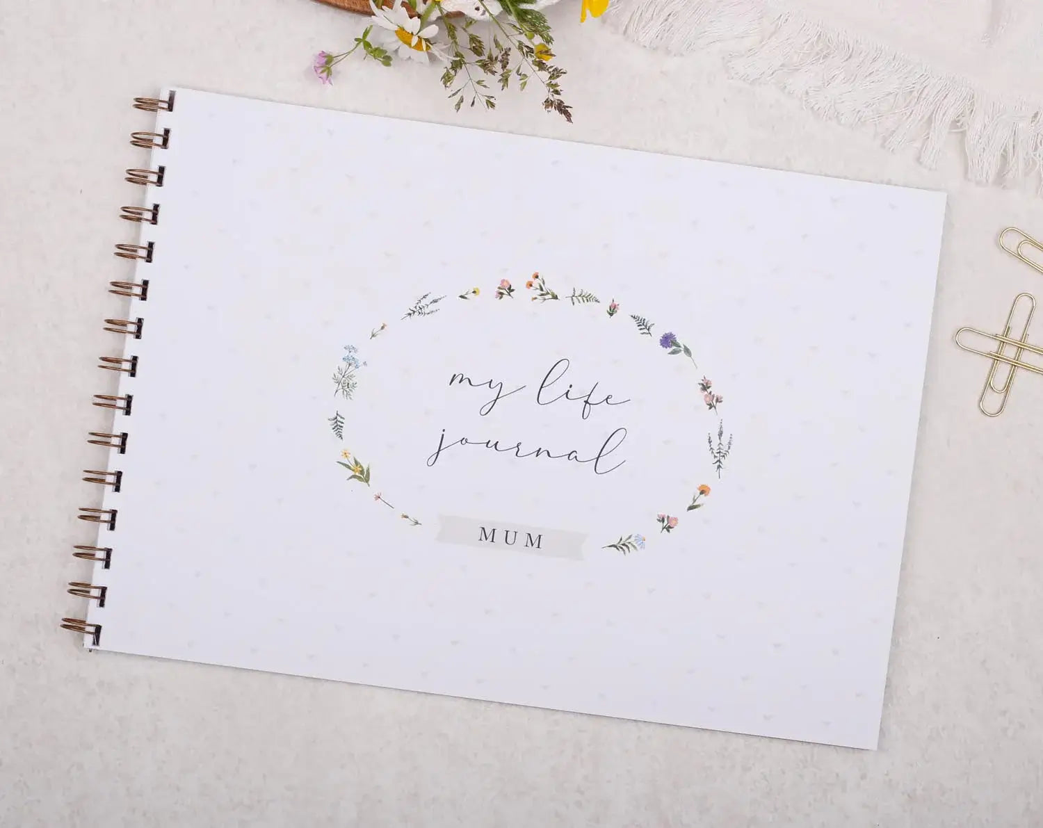 Mums Life Story journal cover with floral design and label "MUM" for mothers to document their lives.