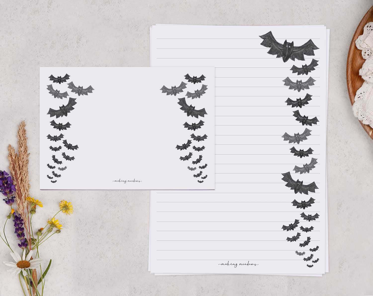 Stationery for Halloween lovers featuring bat designs on notepads and stationery cards.