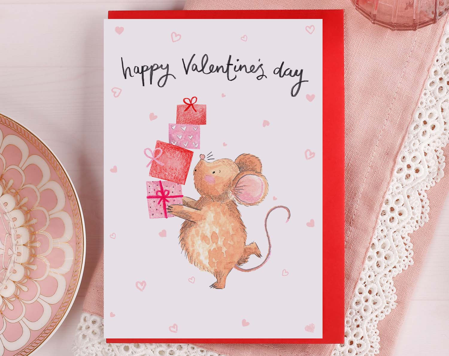 Romantic Valentine Card featuring a cute mouse holding gifts and wishing a happy Valentine's day.