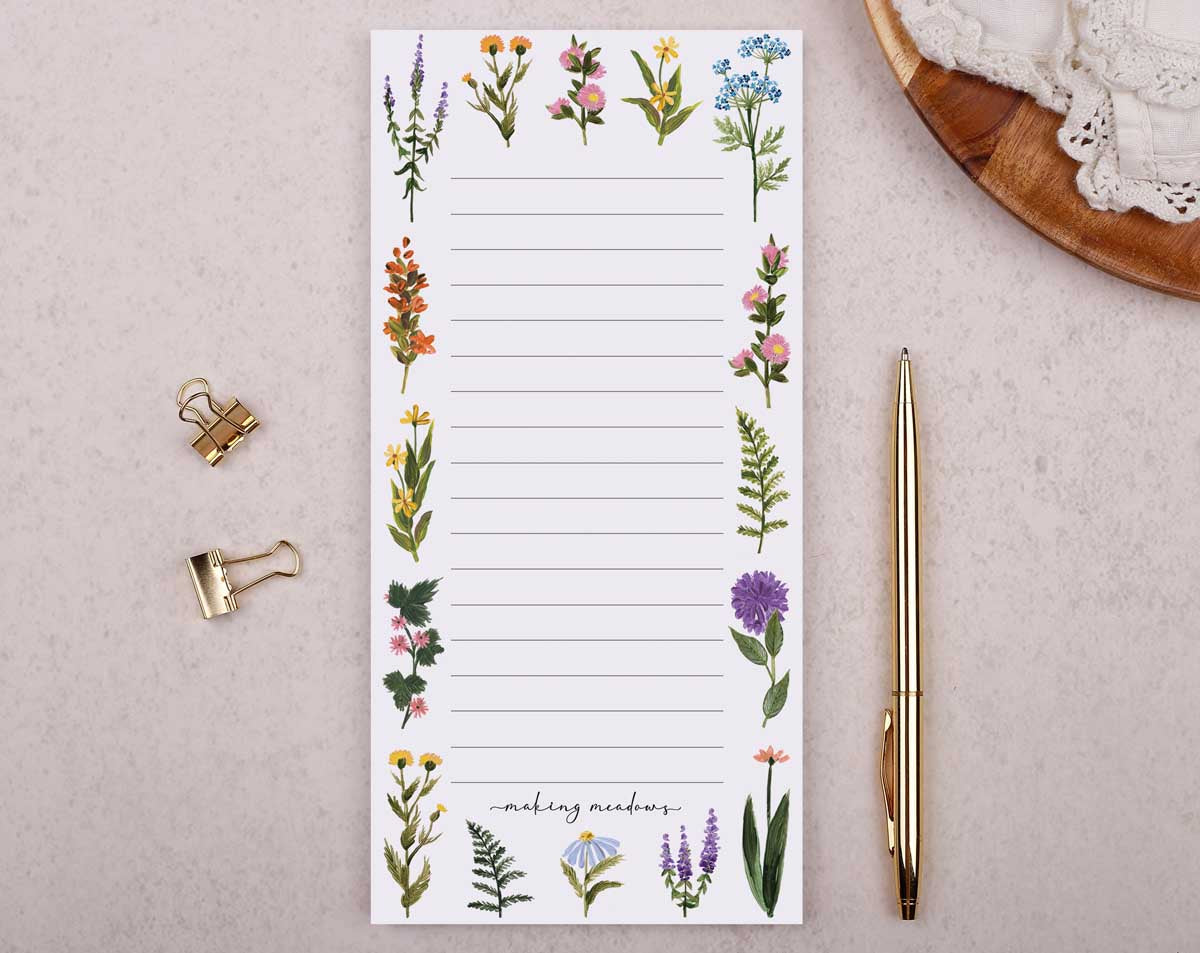 A floral notepad with blank lines, perfect for organizing tasks and notes on how to study as a student.