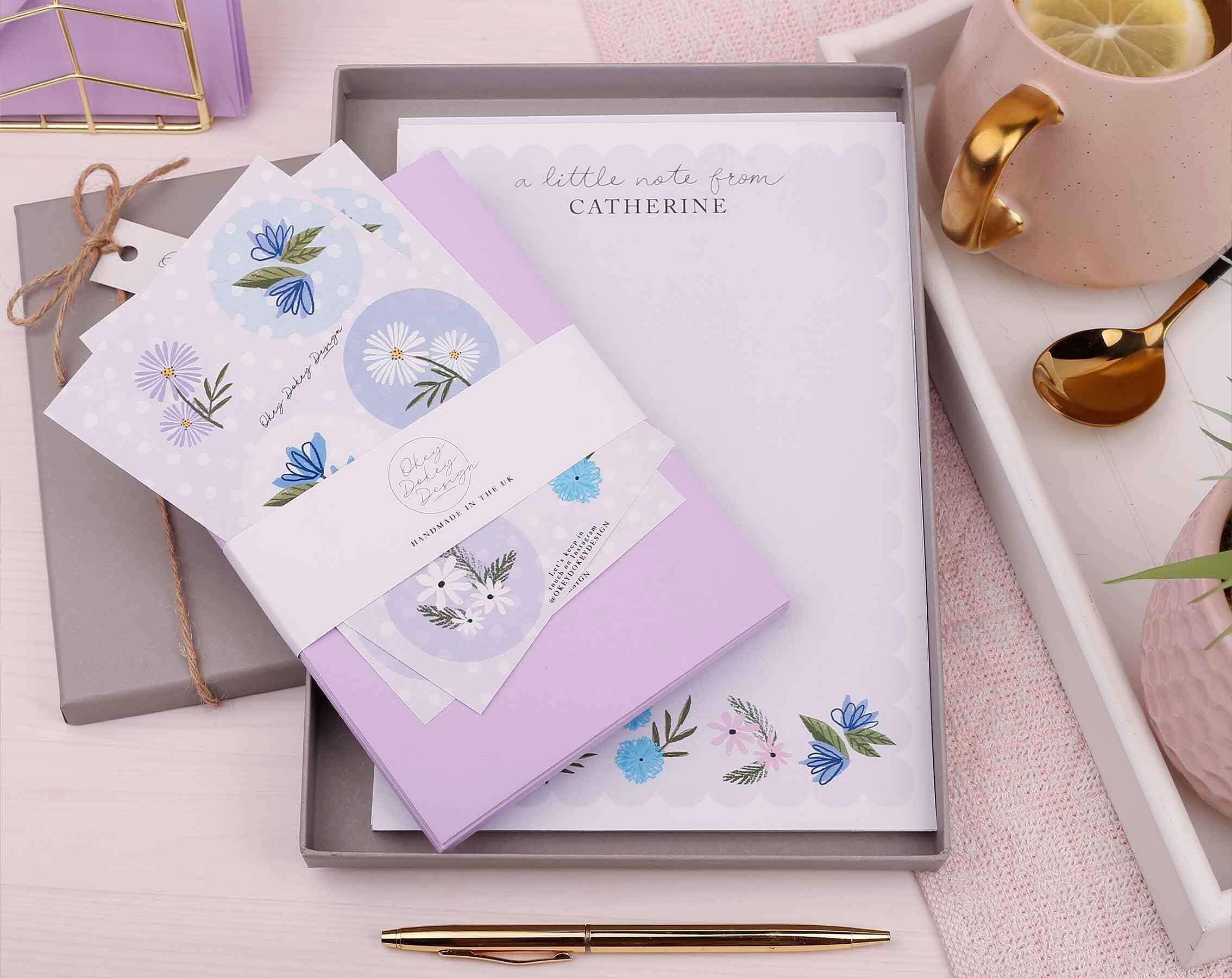 How To Write A Handwritten Letter with decorative stationery and a pen on a stylish tray.