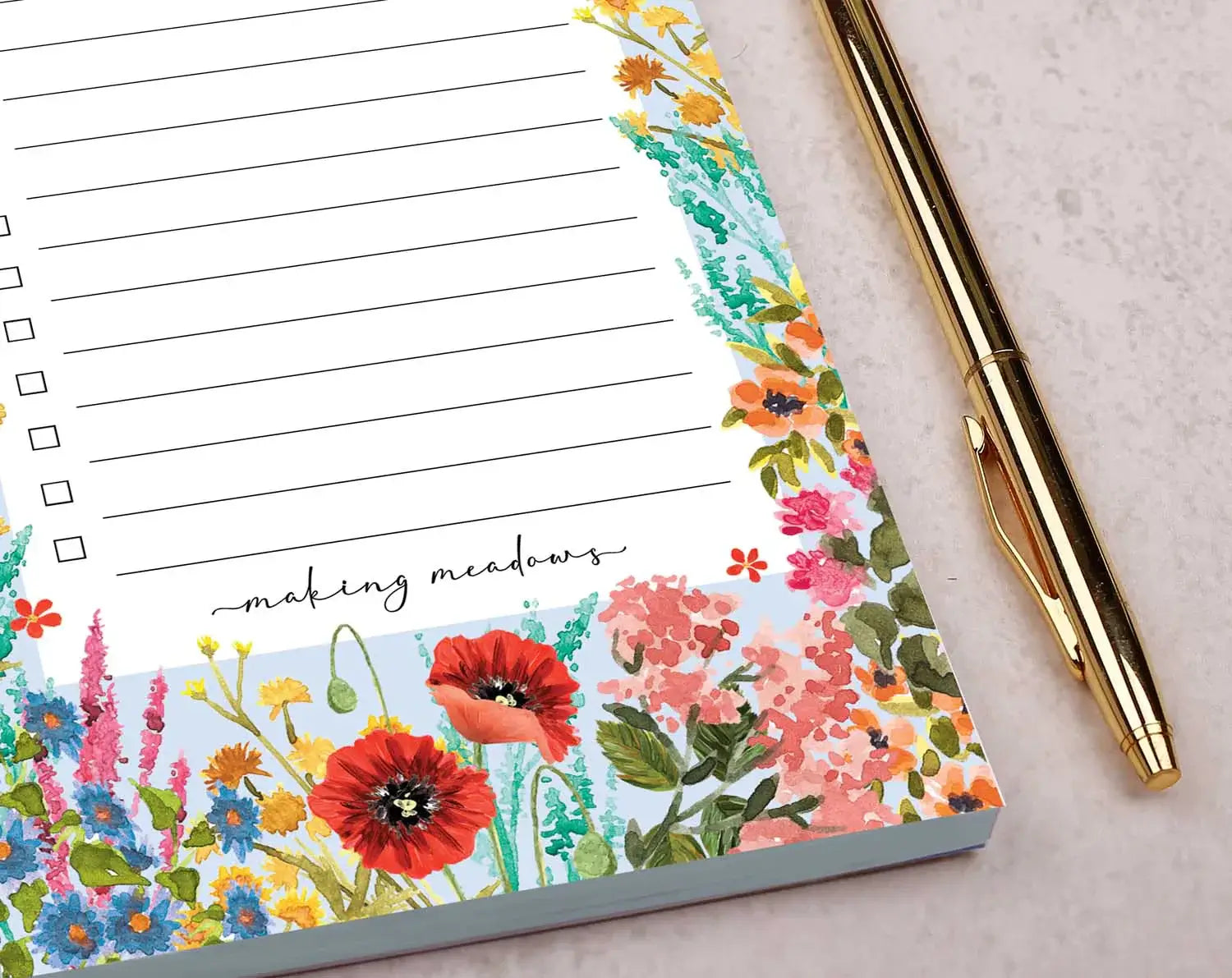 Colorful floral planner pads with checklist lines for organizing tasks creatively.