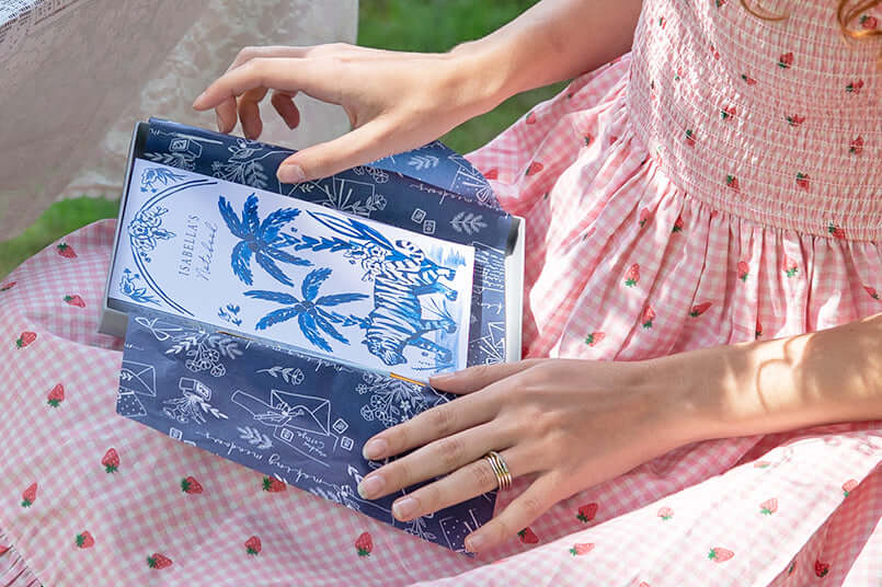 A person holding End of Term Thank You Stationery gift box outdoors with a colorful design.