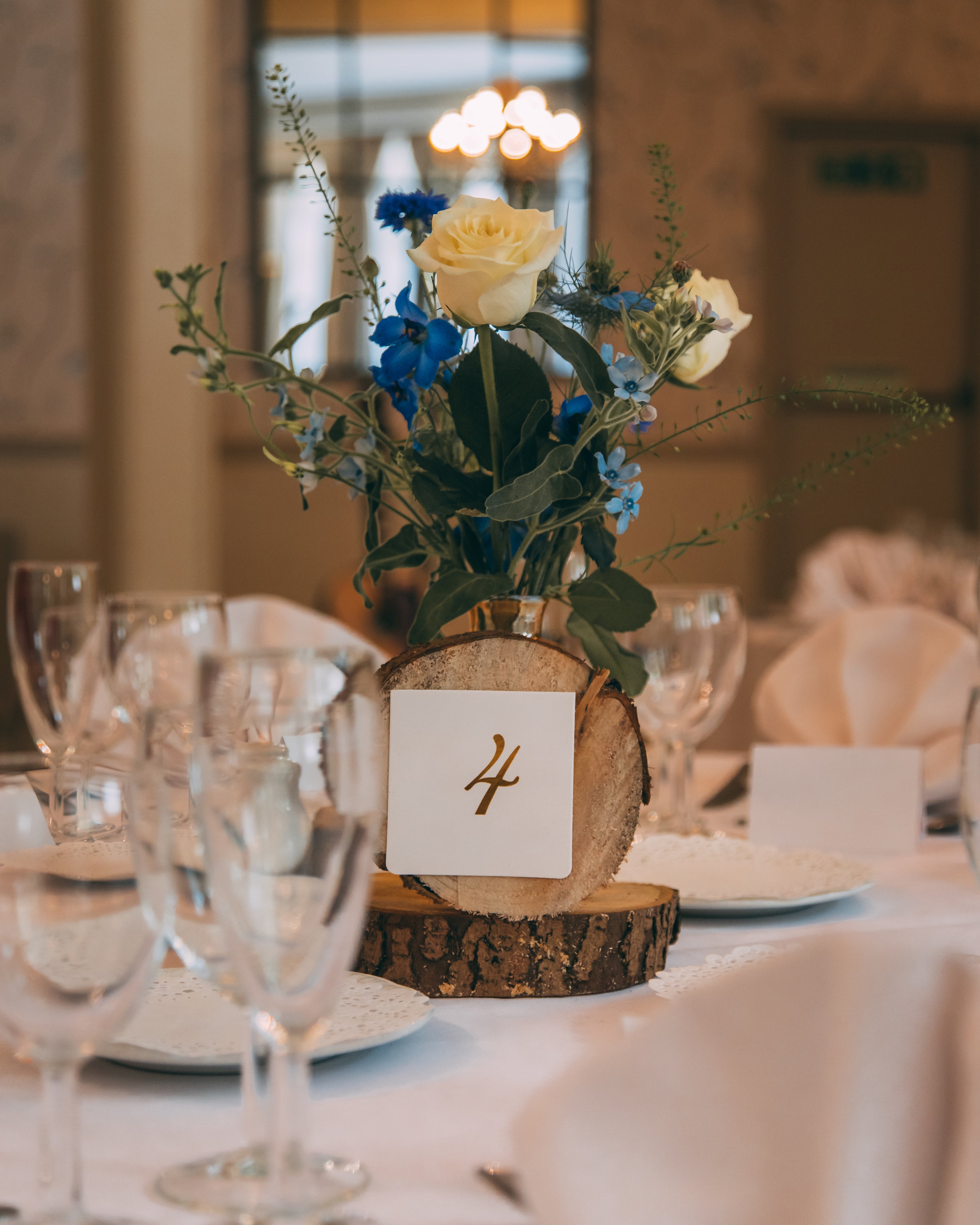 Micro Wedding Stationery featuring a rustic table centerpiece with flowers and a table number.