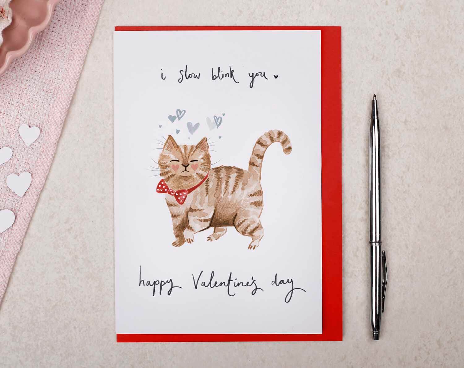 Fuzzy Feelings Valentines Day Cards featuring a playful cat illustration 'slow blinking' for Valentine's Day.