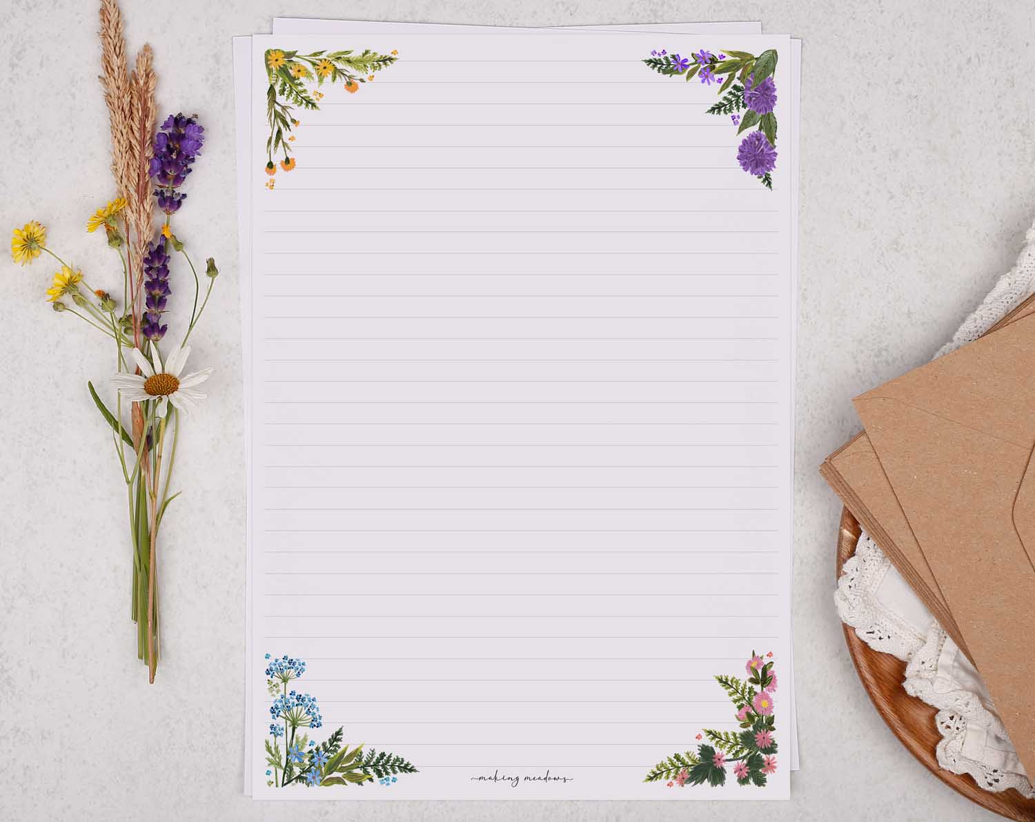 A4 letter writing paper sheets with a floral cluster of flowers in each corner. 
