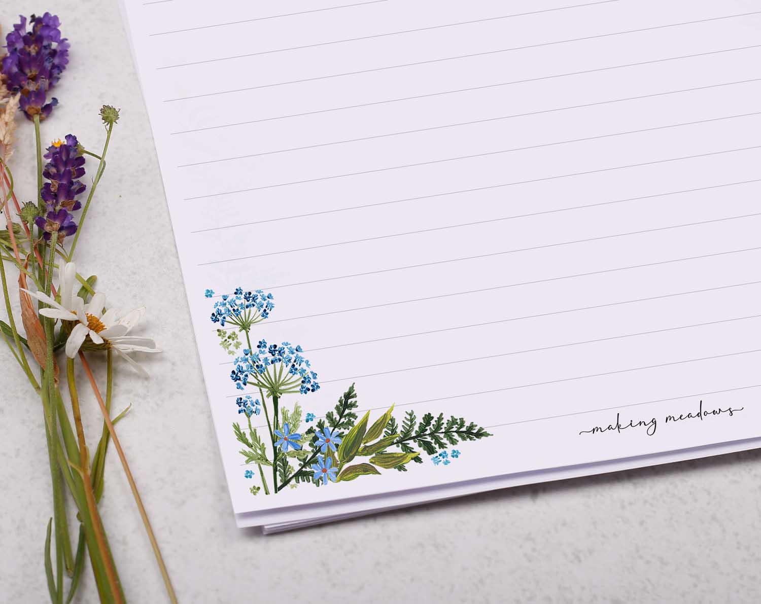A4 letter writing paper sheets with a floral cluster of flowers in each corner. 