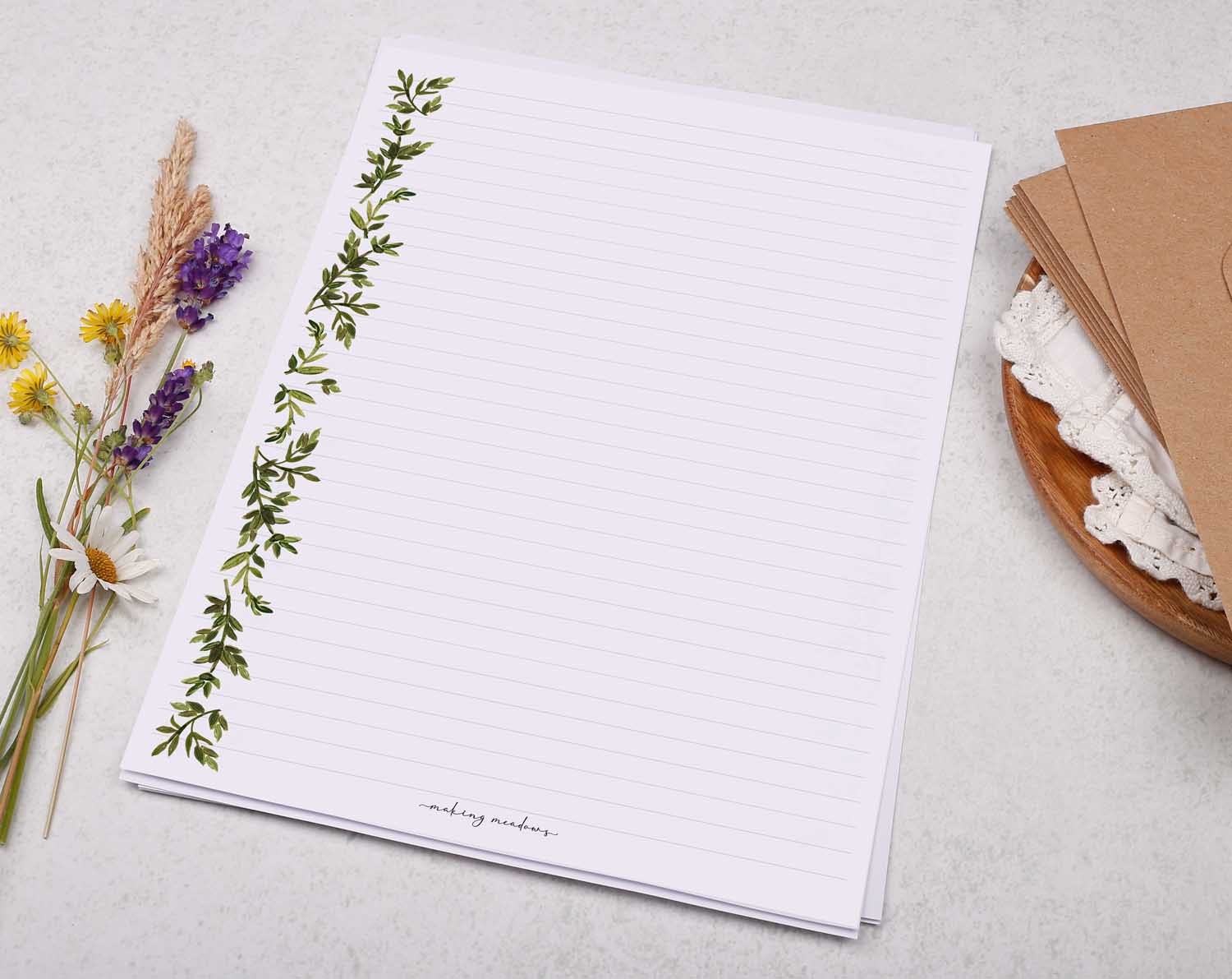 A4 letter writing paper sheets with a blue floral post border around the letter paper in a delicate leaf pattern.
