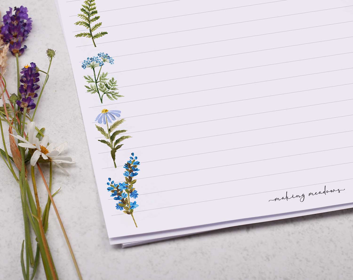 A4 letter writing paper sheets with a blue flower border around the letter paper in a delicate flower pattern.