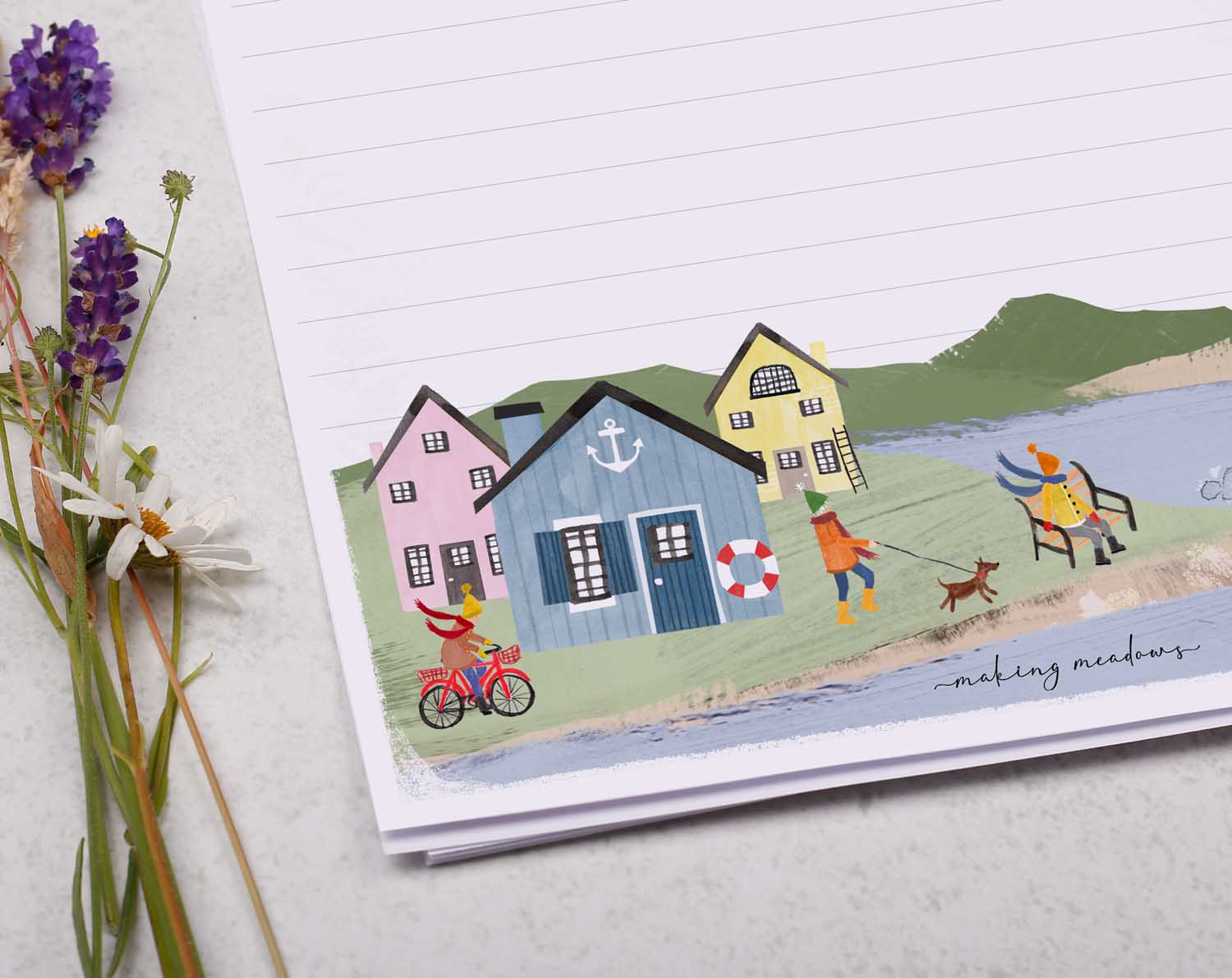 A4 letter writing paper sheets with a cute illustration of an English seaside town surrounded by rolling cliffs.