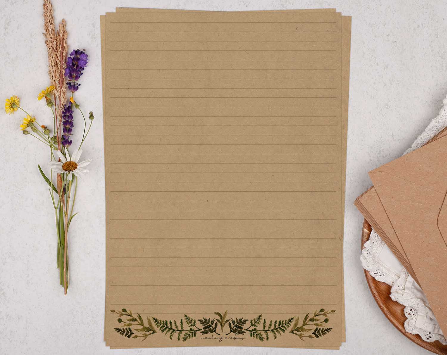 A4 Kraft letter writing paper sheets with a watercolour botanical border design along the bottom.