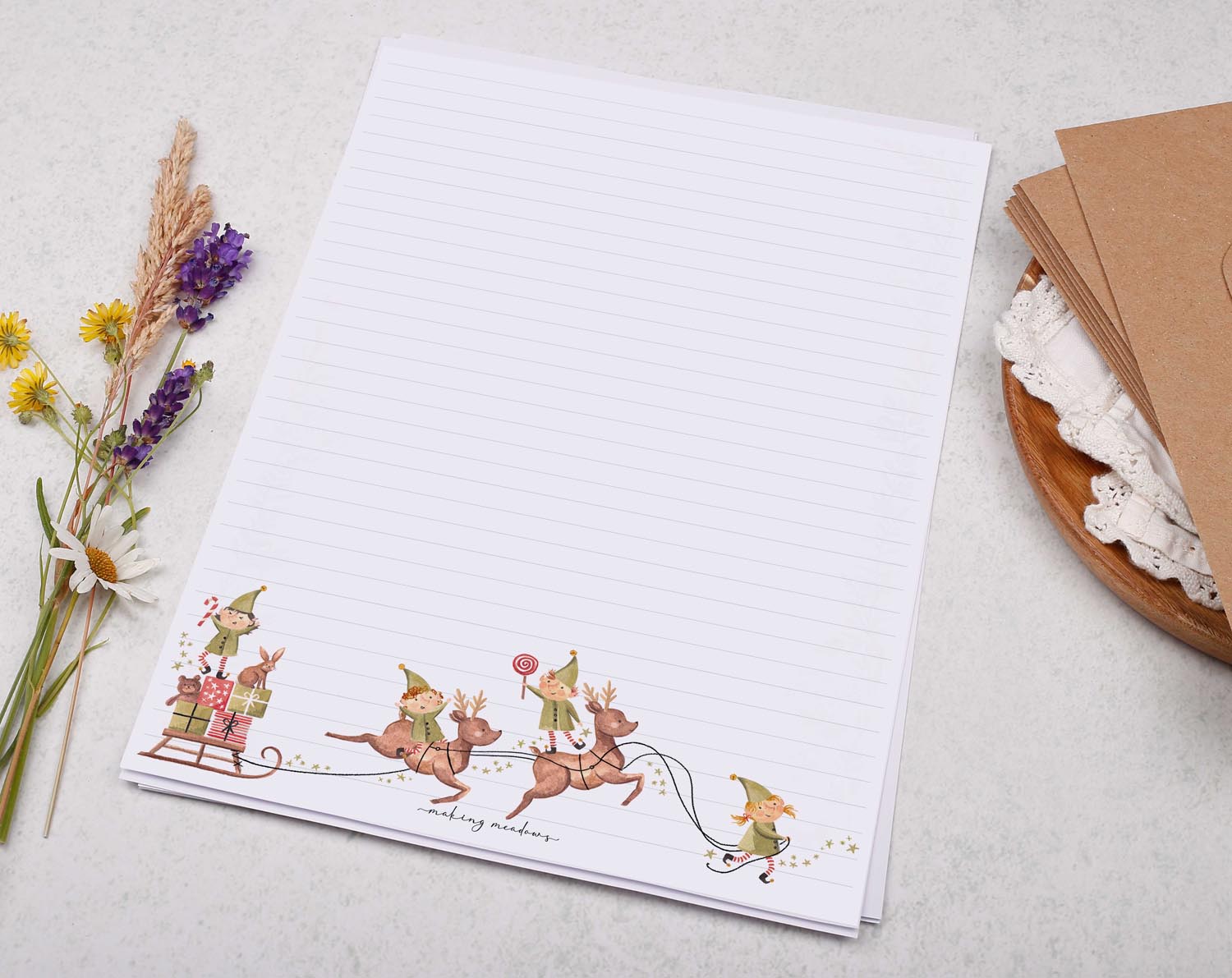 A4 writing paper with Christmas Elves on Reindeer. Stationery designed by Making Meadows