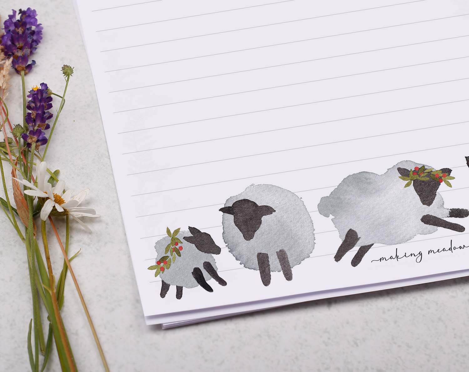 A4 writing paper with Festive Sheep featuring hand-painted sheep designs along the bottom.