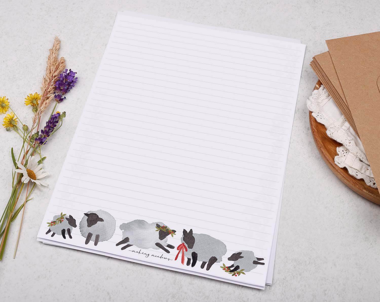 A4 writing paper with Festive Sheep featuring cute sheep illustrations and lined pages.