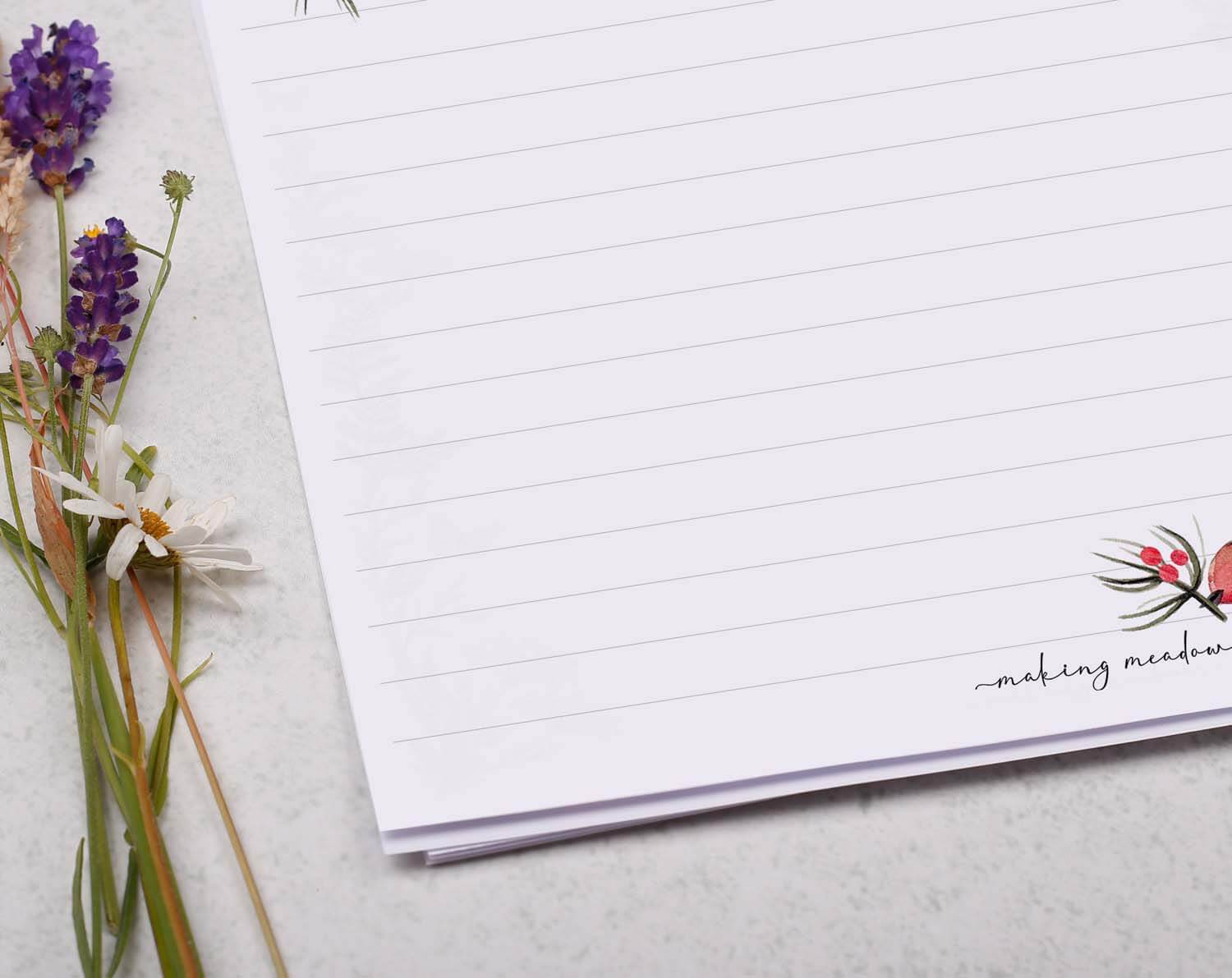 A4 writing paper with Robin featuring beautiful floral designs and lined sections, perfect for festive writing.