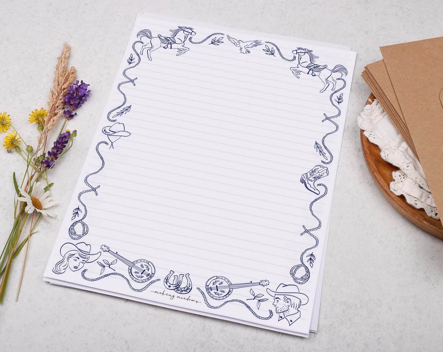 A4 writing paper with a blue cowboy border. Stationery designed by Making Meadows