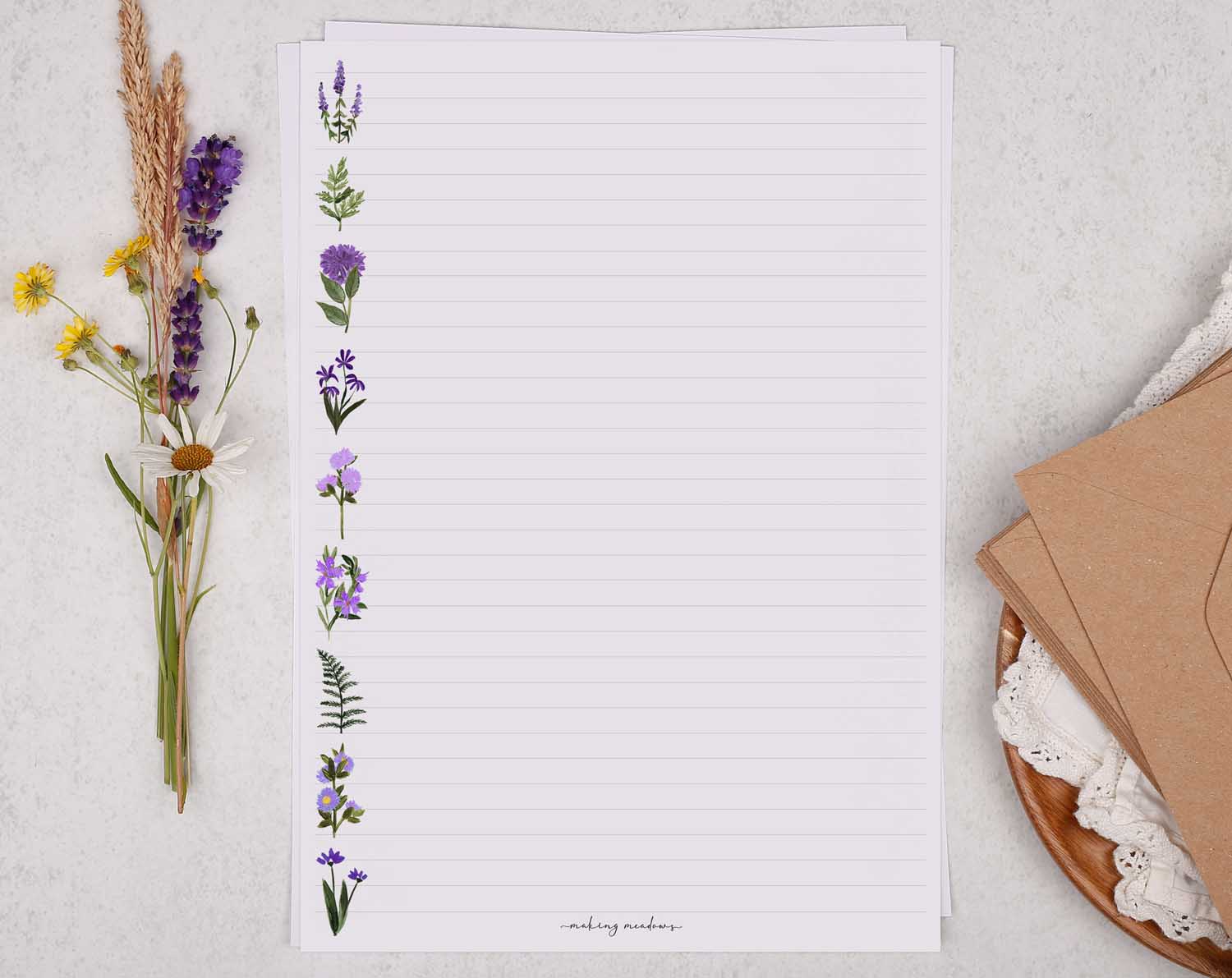 A4 writing paper with purple flower border. Stationery designed by Making Meadows