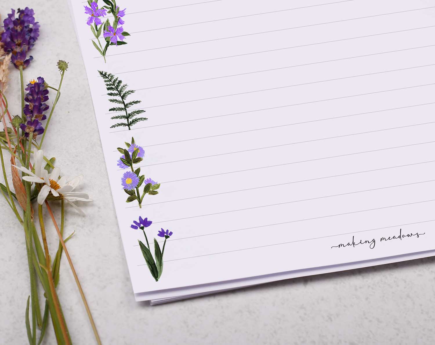 A4 writing paper with purple flower border. Stationery designed by Making Meadows