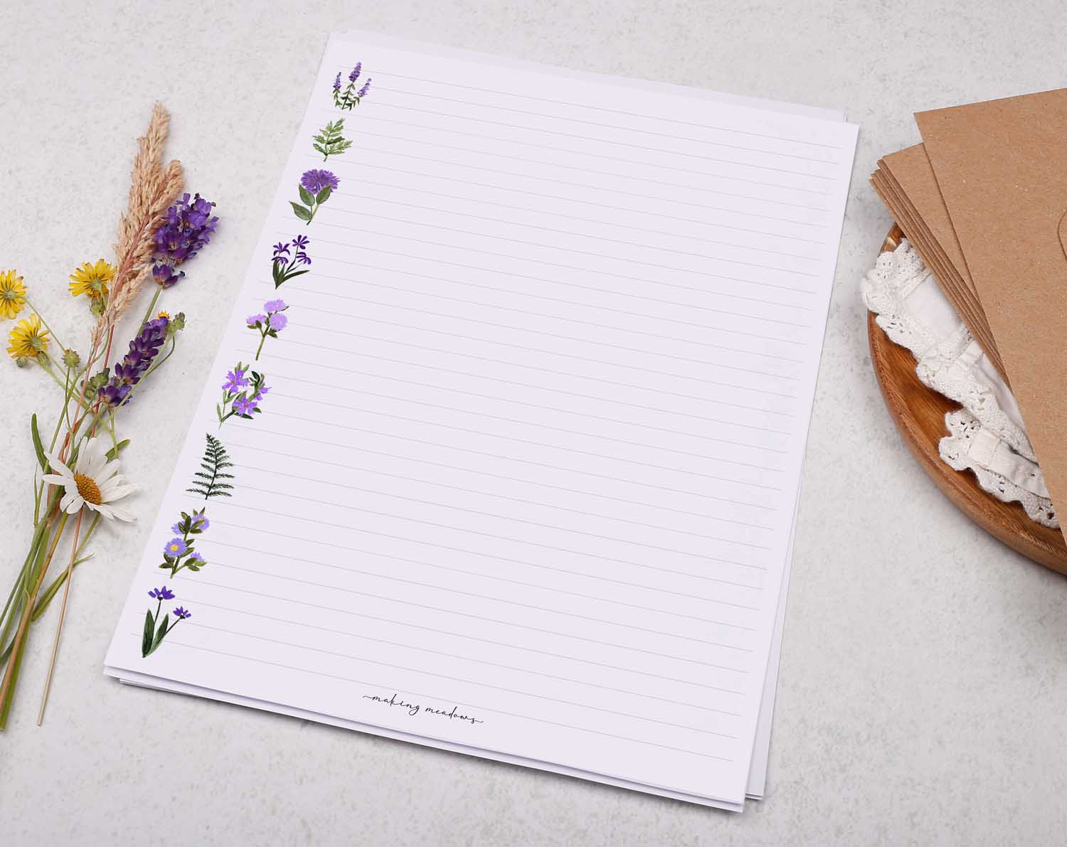 A4 writing paper with purple flower border. Stationery designed by Making Meadows