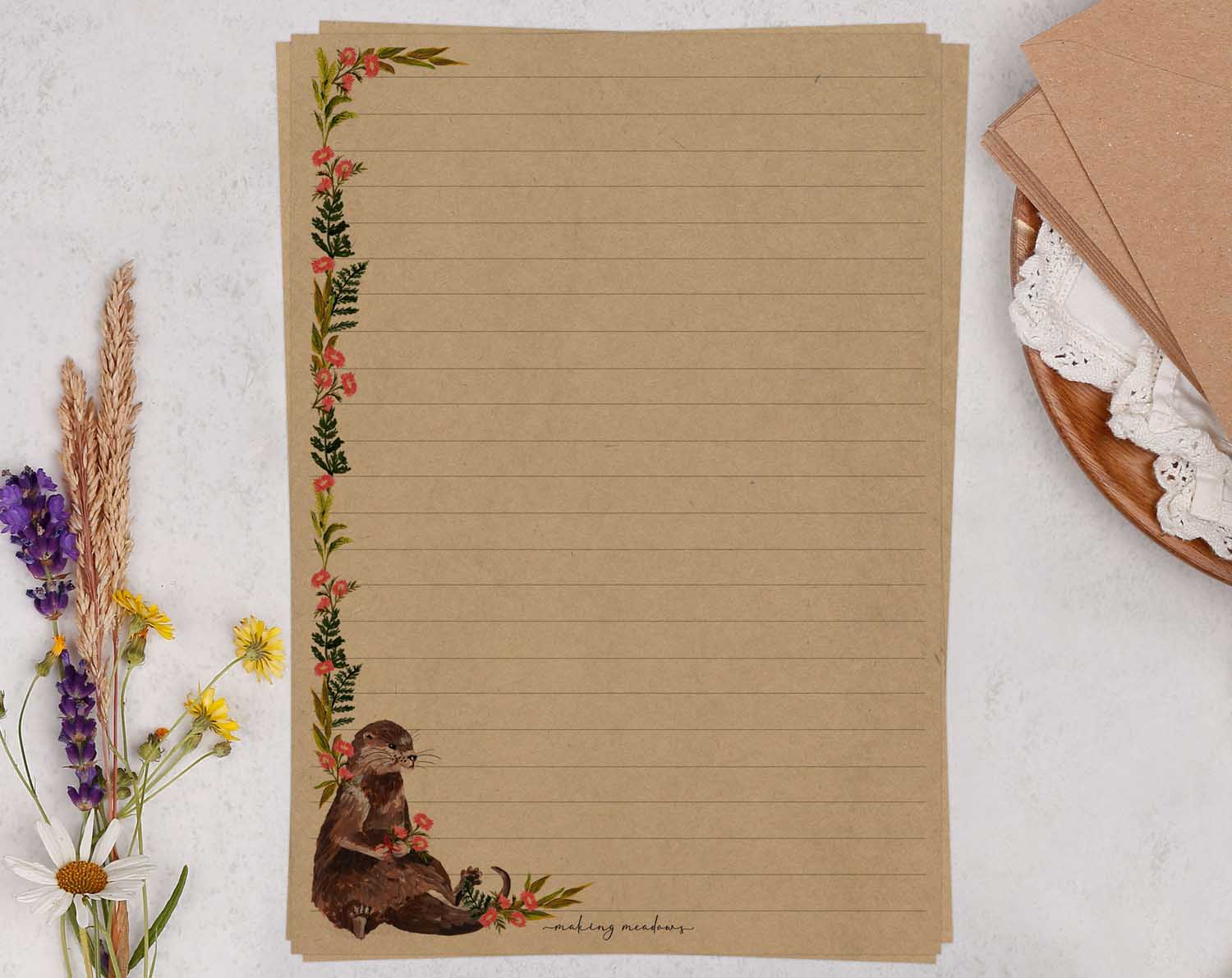 A5 Kraft letter writing paper sheets with otter and pink flowers design. 