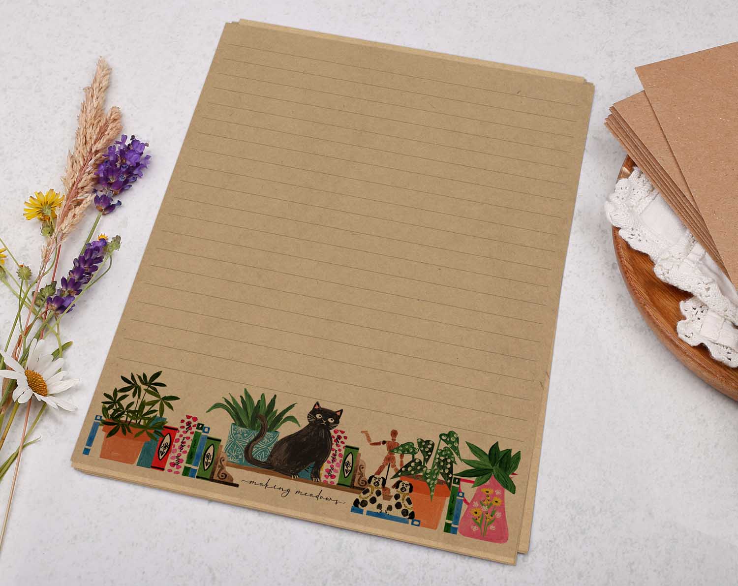 A5 Kraft letter writing paper sheets with books on bookshelf and a cat design.