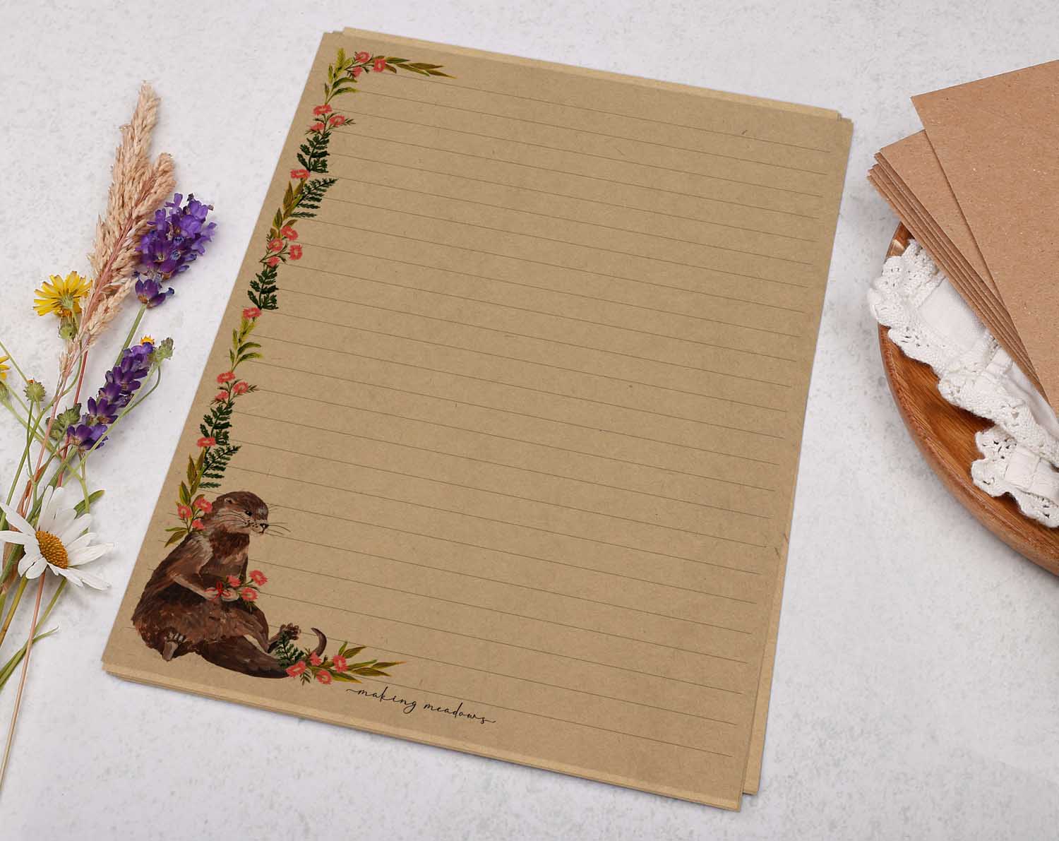 A5 Kraft letter writing paper sheets with otter and pink flowers design. 