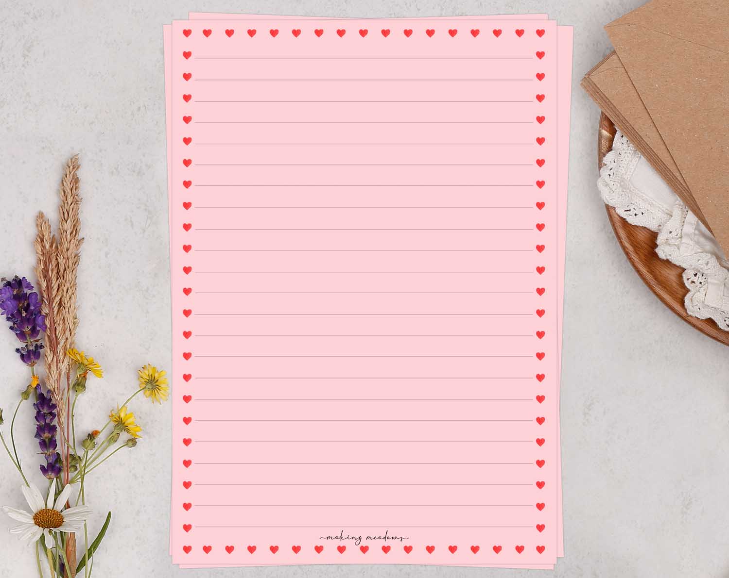 Pink A5 letter writing paper sheets adorned with cute ditsy red hearts.
