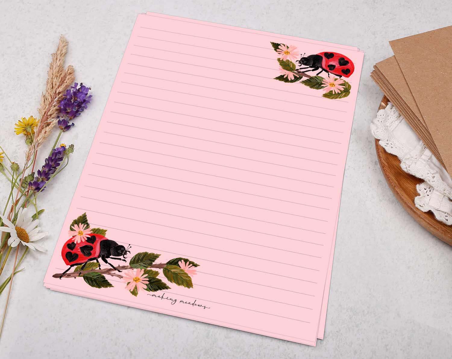 A5 pink writing paper with ladybird bugs. Stationery designed by Making Meadows