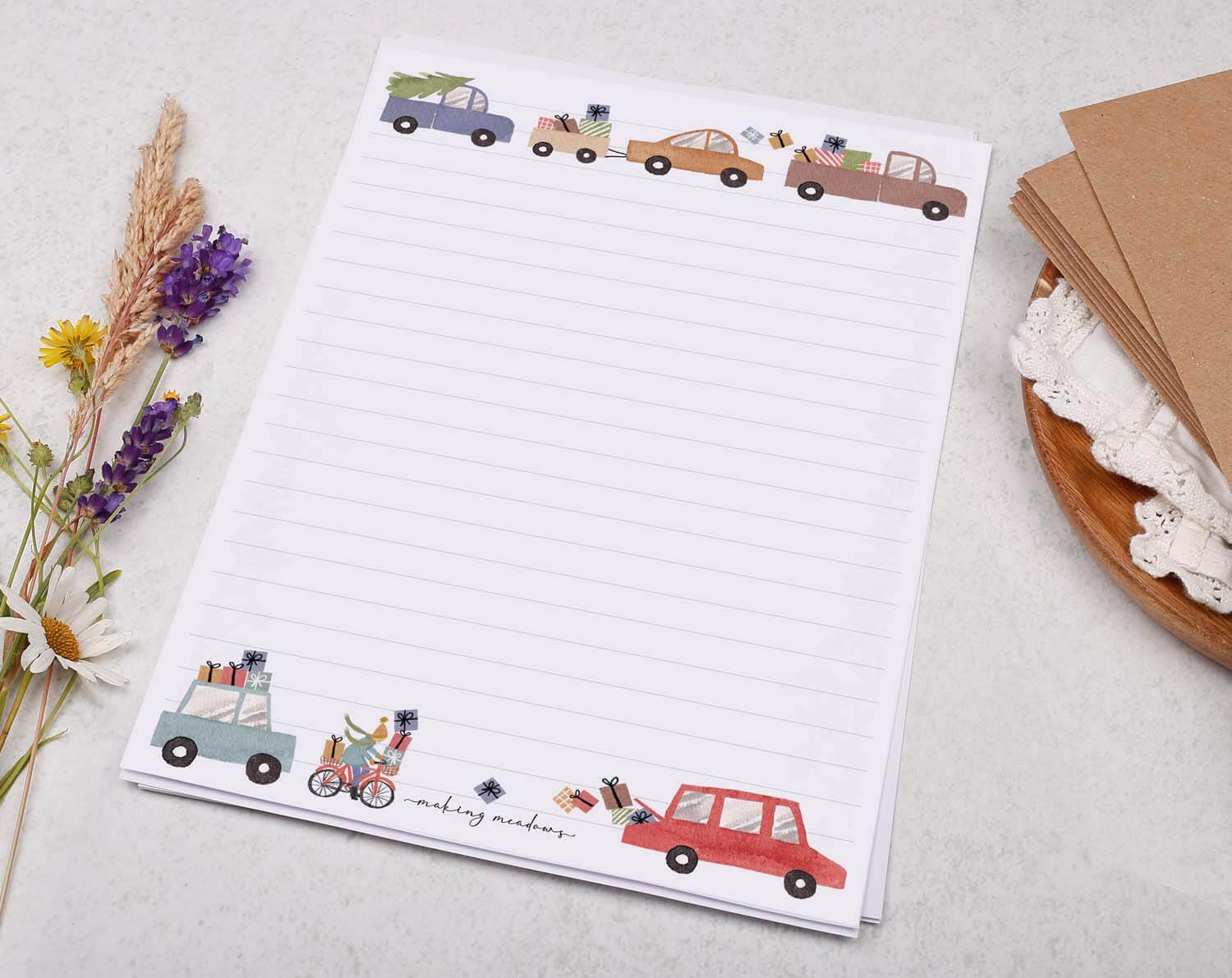 A5 writing paper with Driving Home For Christmas featuring colorful cars and festive decorations.