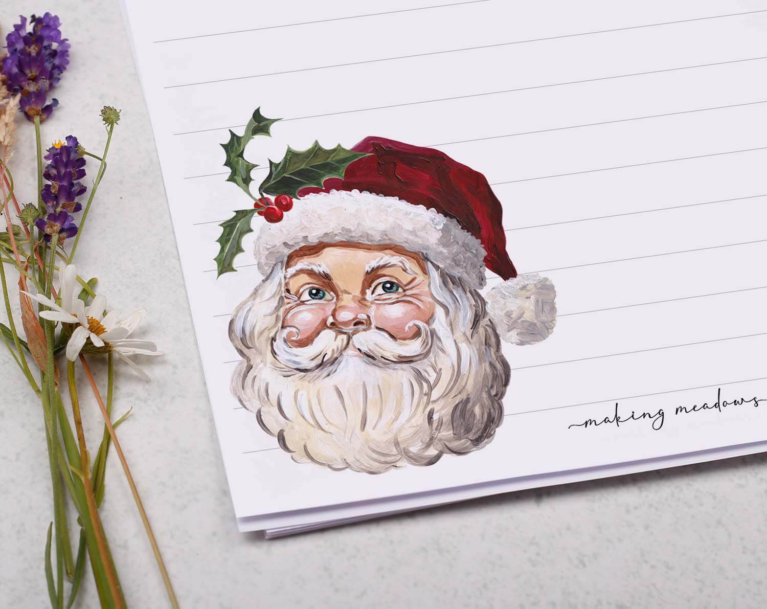 A5 writing paper with Father Christmas featuring a festive Santa Claus illustration and holly accents.