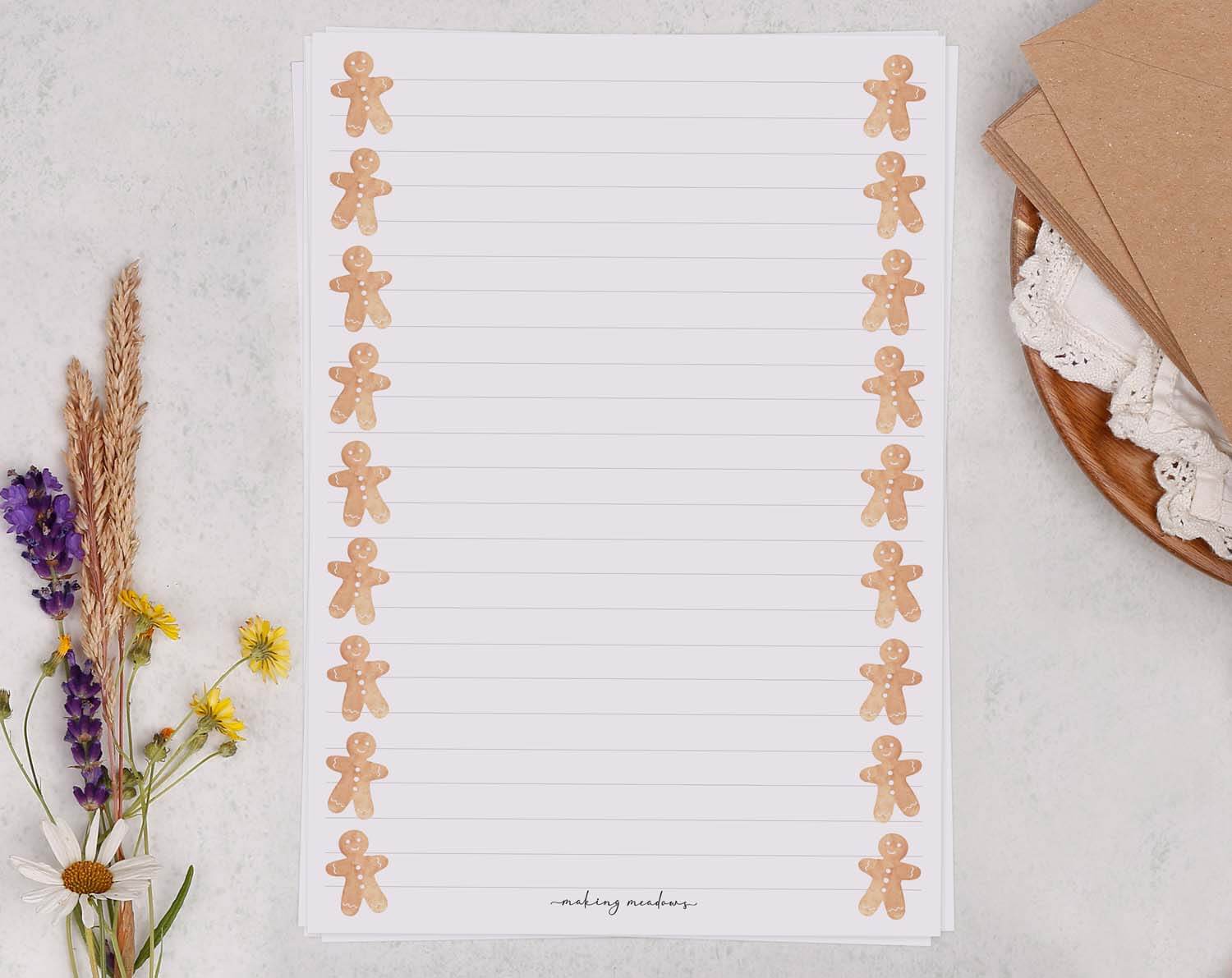 A5 writing paper with Gingerbread Men featuring cute gingerbread figures along the sides, perfect for festive notes.