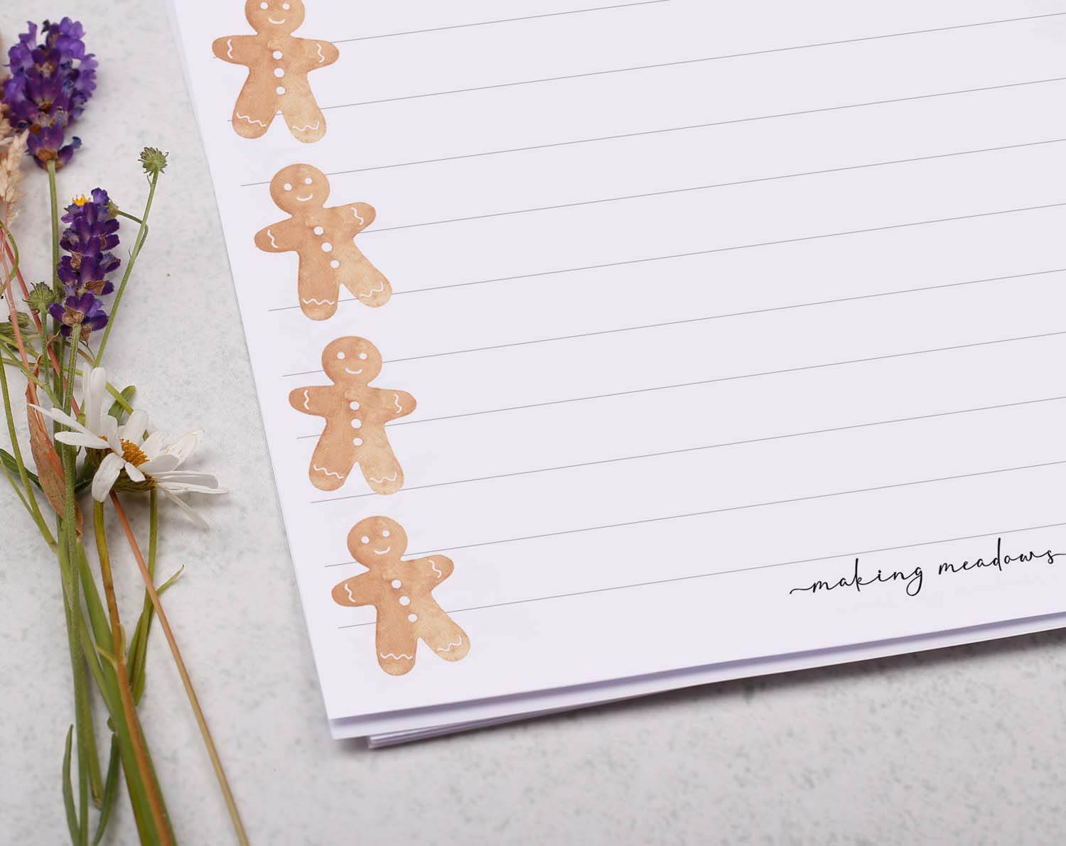 A5 writing paper with Gingerbread Men featuring cute gingerbread figures along the sides, perfect for festive notes.
