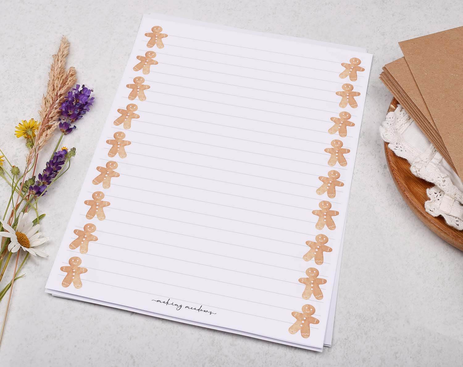 A5 writing paper with Gingerbread Men featuring cute gingerbread designs on the sides, perfect for festive notes and letters.