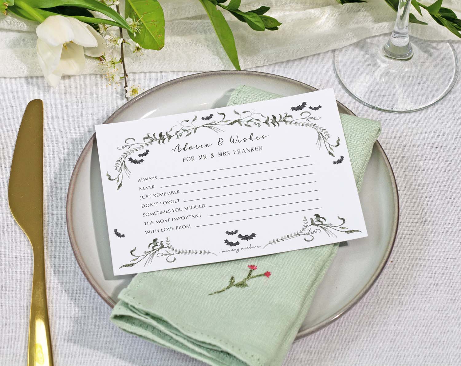 Gothic Wedding Advice Cards on a table setting with greenery and a plate, designed for sharing advice and wishes.