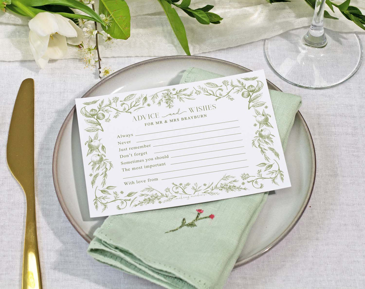 Sage Garden Wedding Advice Cards on a plate with a napkin, inviting guests to share wishes and advice.