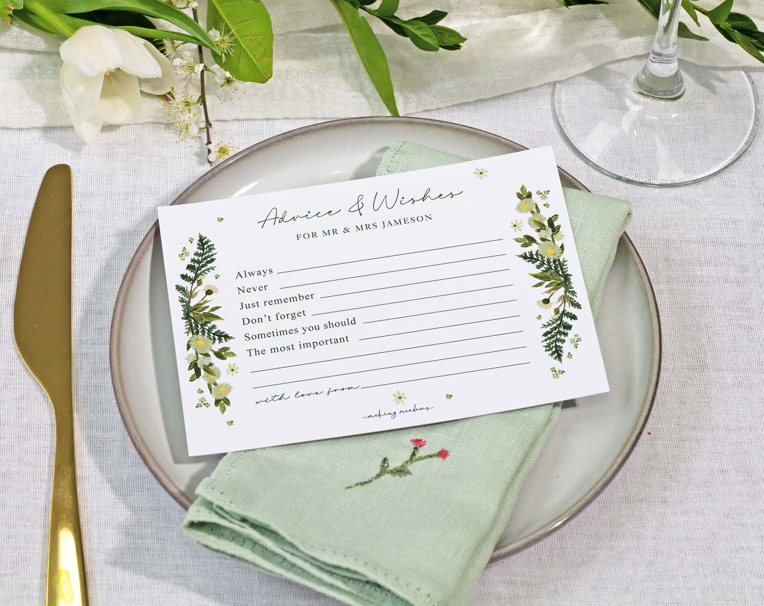 Botanical Wedding Advice Cards on a plate with a napkin, ready for guests to share advice and wishes.
