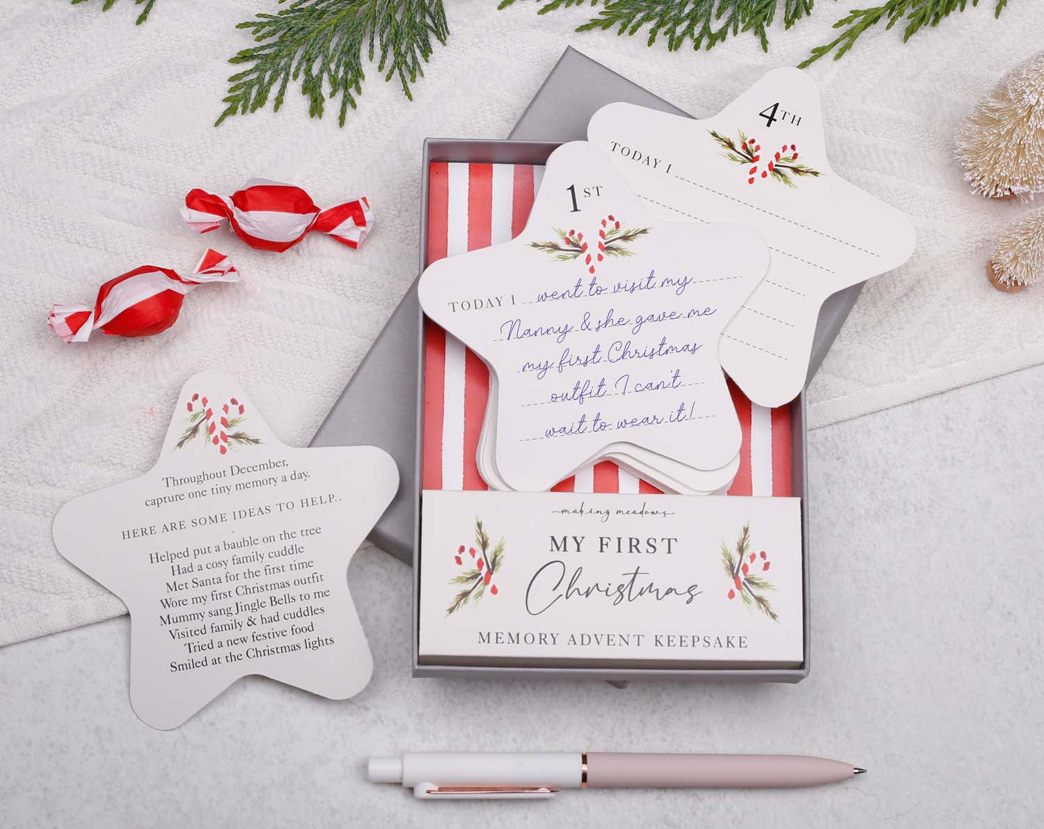 Baby's First Christmas Advent Keepsake with memory cards in a festive box for capturing memories in December.