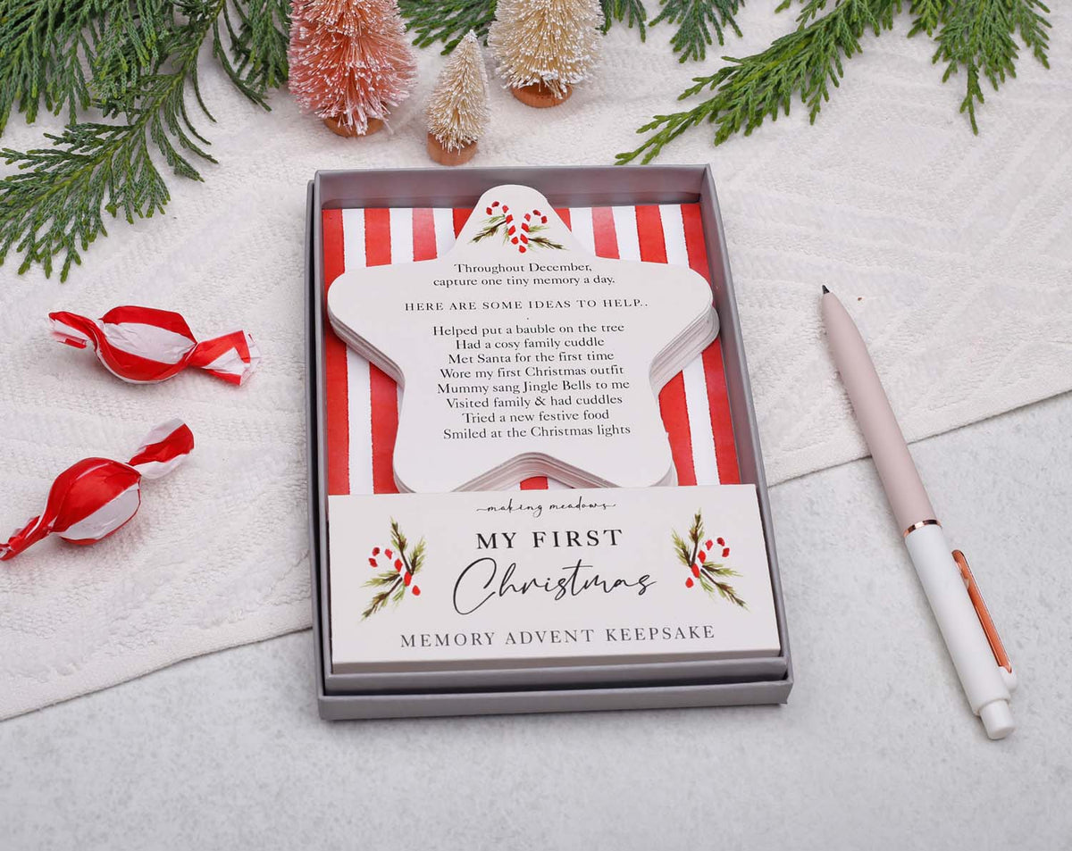 Baby's First Christmas Advent Keepsake in a decorated box with festive accessories for capturing holiday memories.