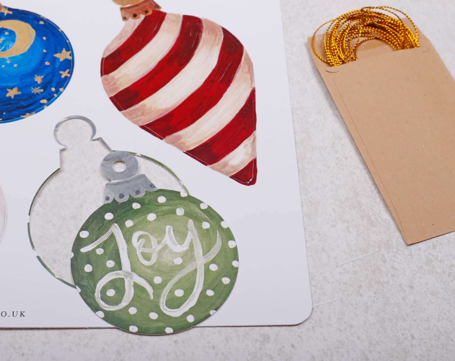 Bauble Christmas Gift Tags featuring vibrant ornament illustrations and gold twine for festive gift wrapping.