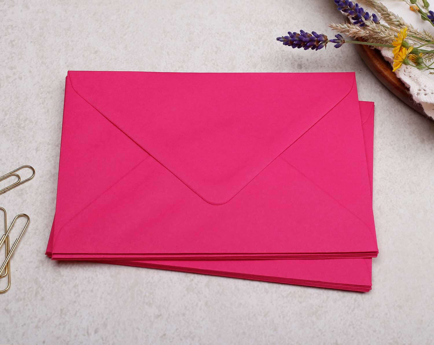 Bright pink envelopes perfect for sending Biscuit Personalised Note Cards.