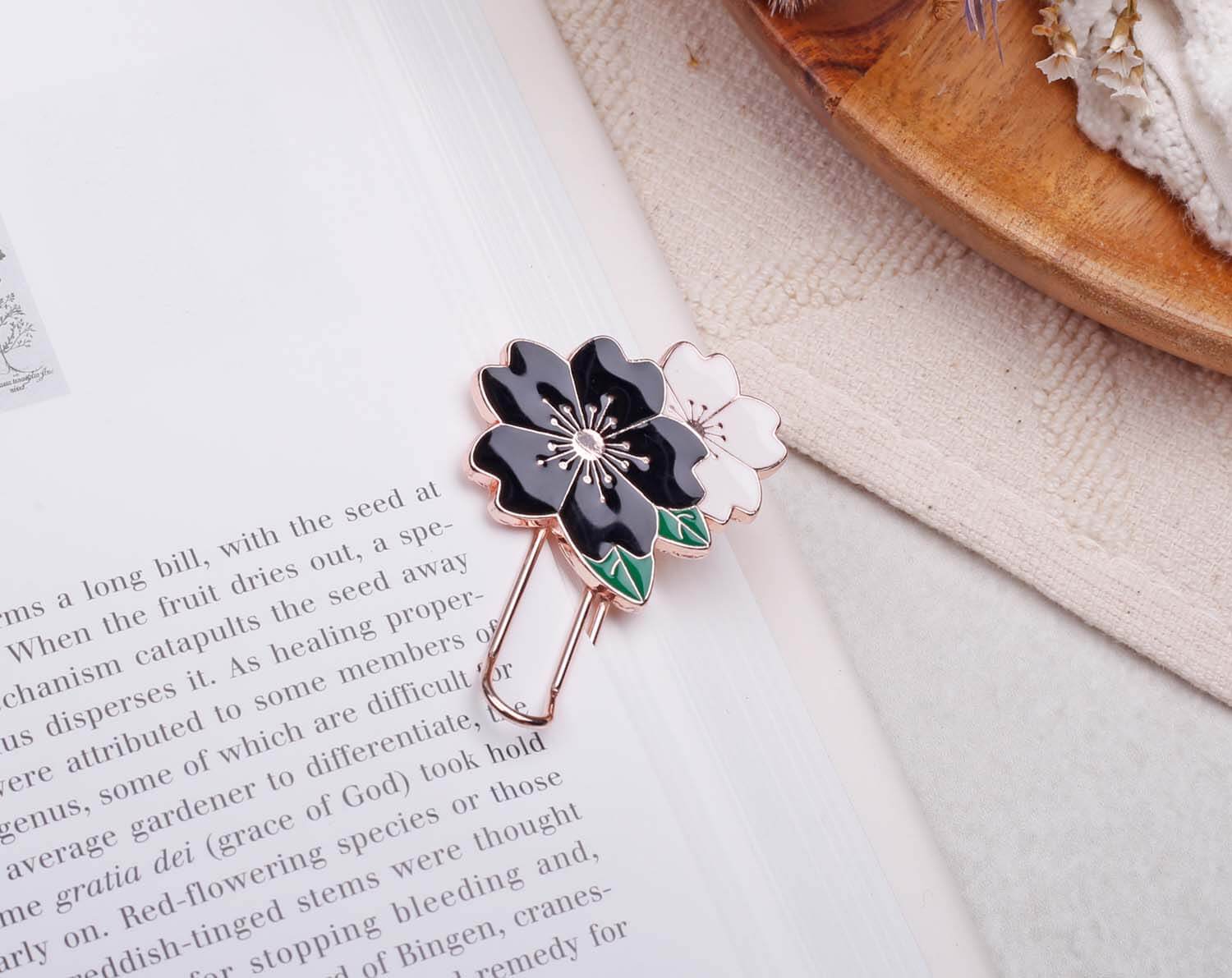 Black Flower Paper Clips on a page, featuring a black flower design and a pink flower accent.