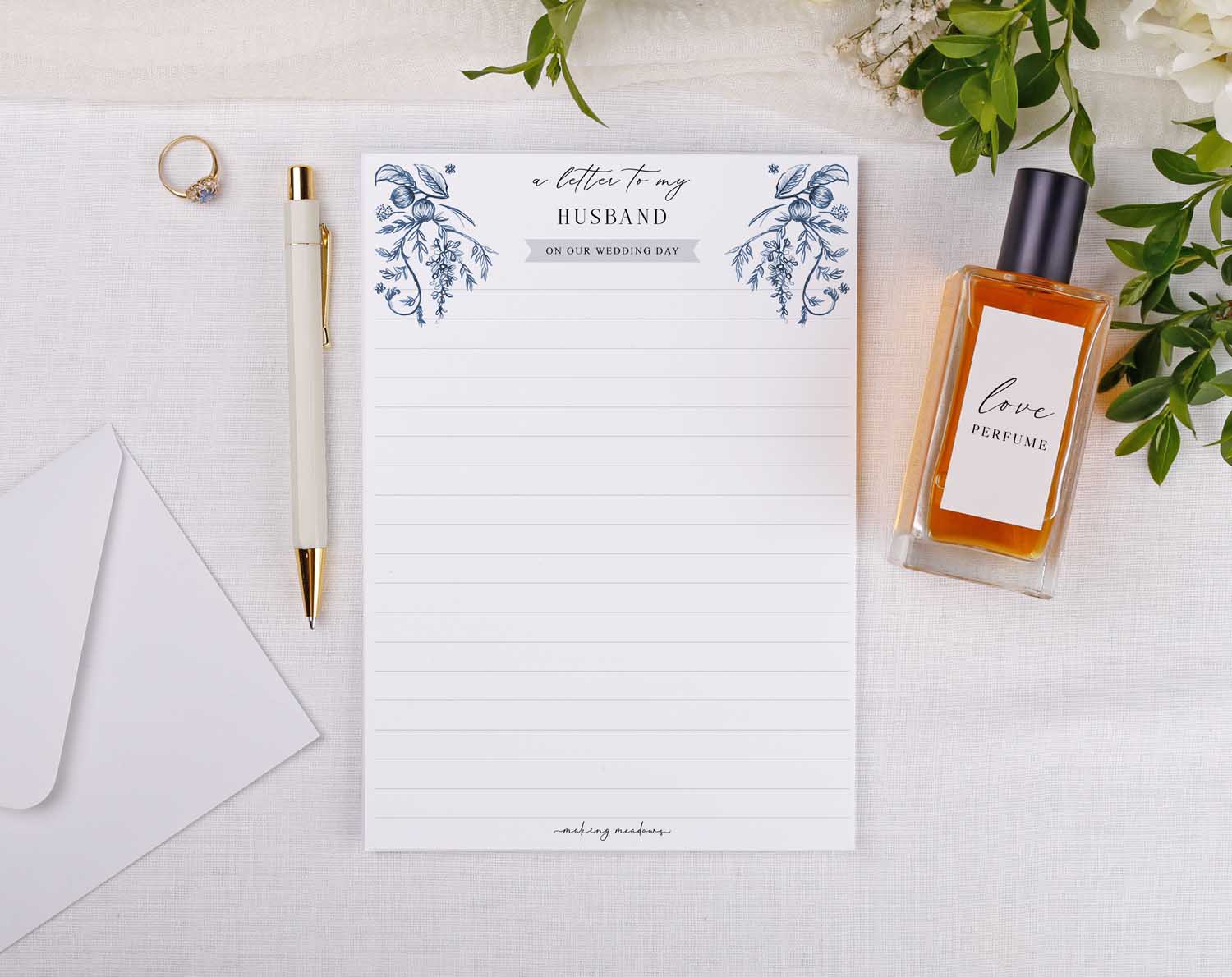 Blue Garden Wedding Letter to My Husband on a beautiful stationery with pen and a perfume bottle.